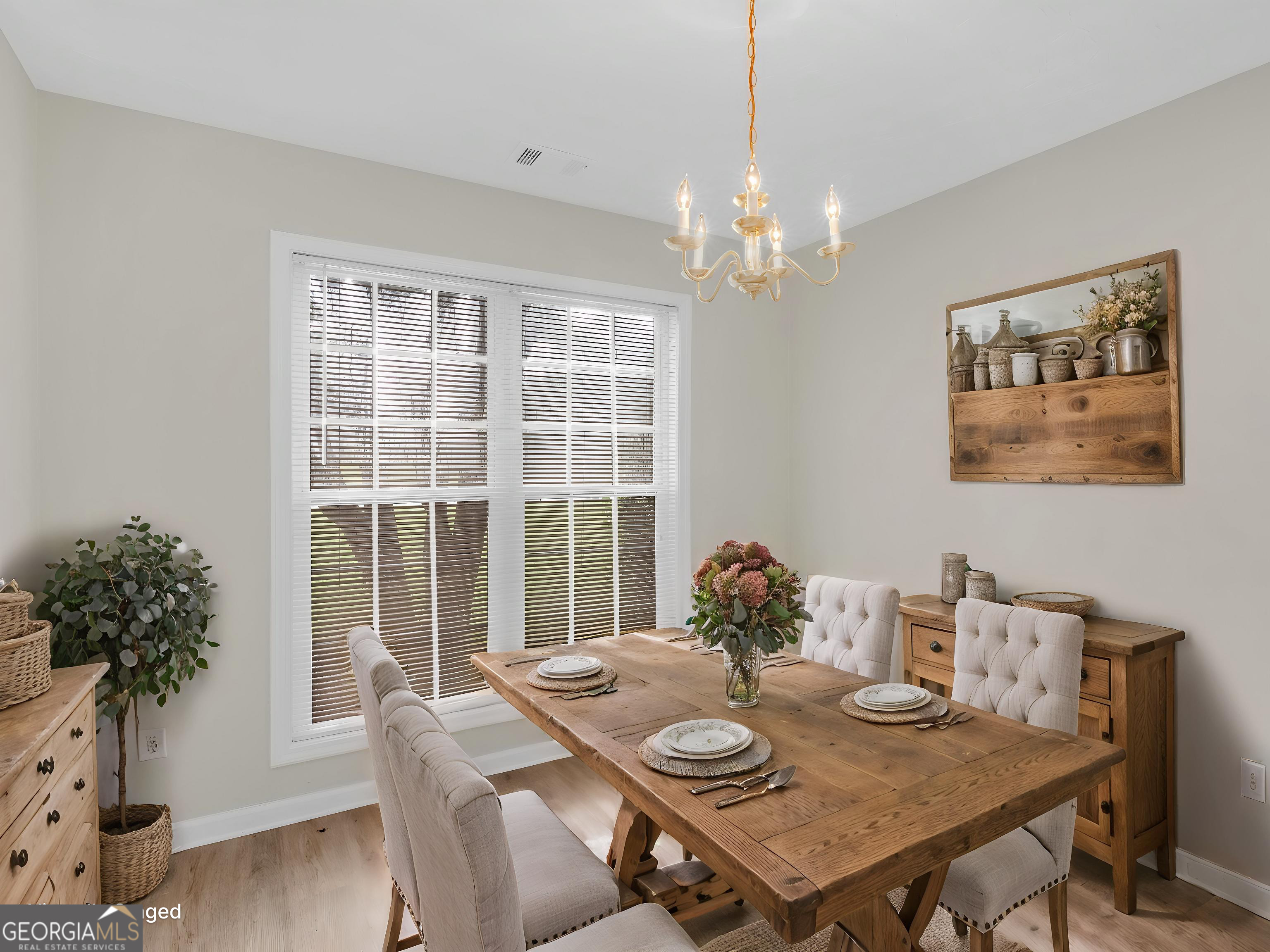 404 Northwind Place Stockbridge, GA 30281 - Photo 19 of 56 a view of a dining room with furniture window and wooden floor