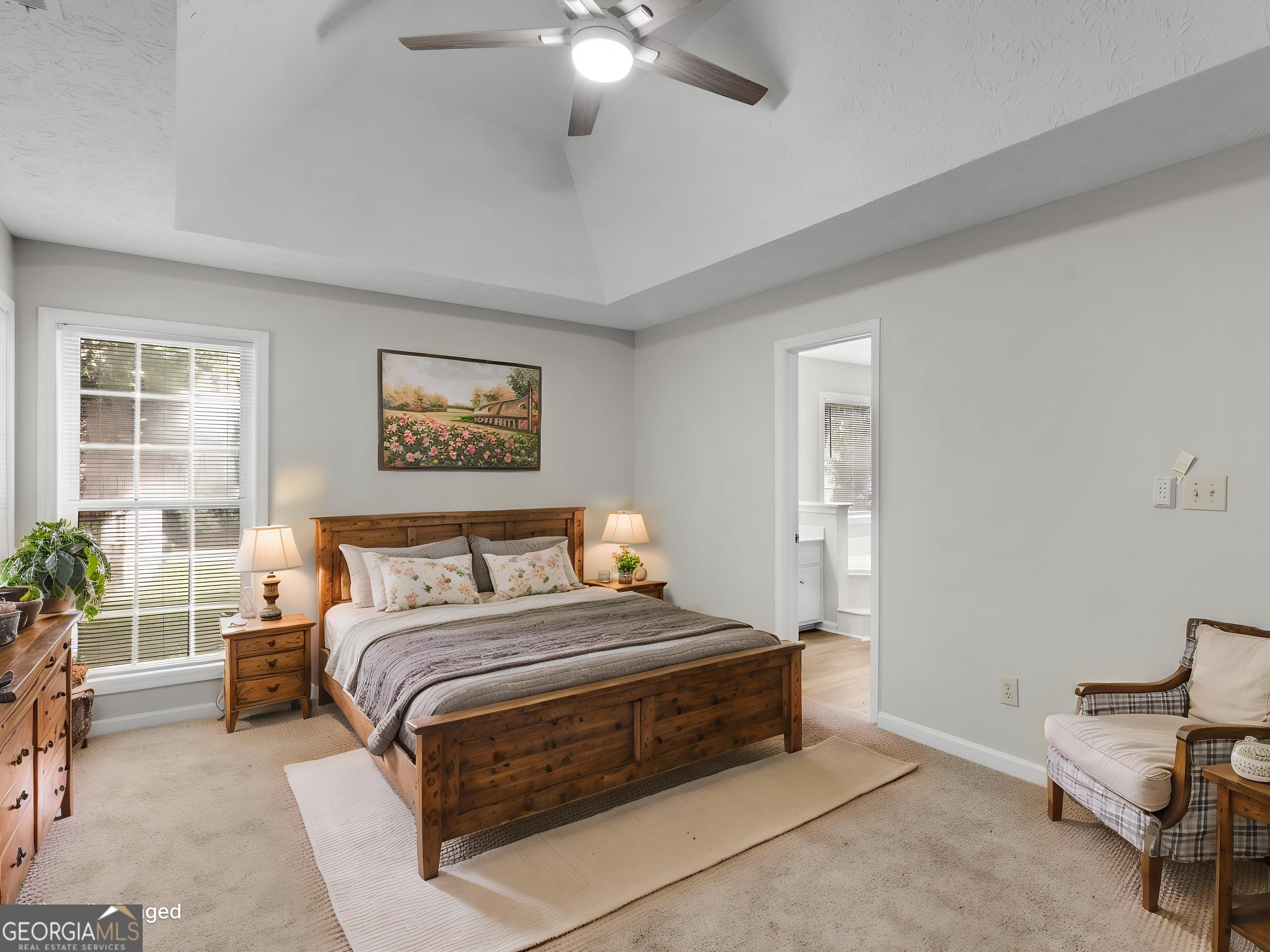 404 Northwind Place Stockbridge, GA 30281 - Photo 32 of 56 a bedroom with a bed and a chair