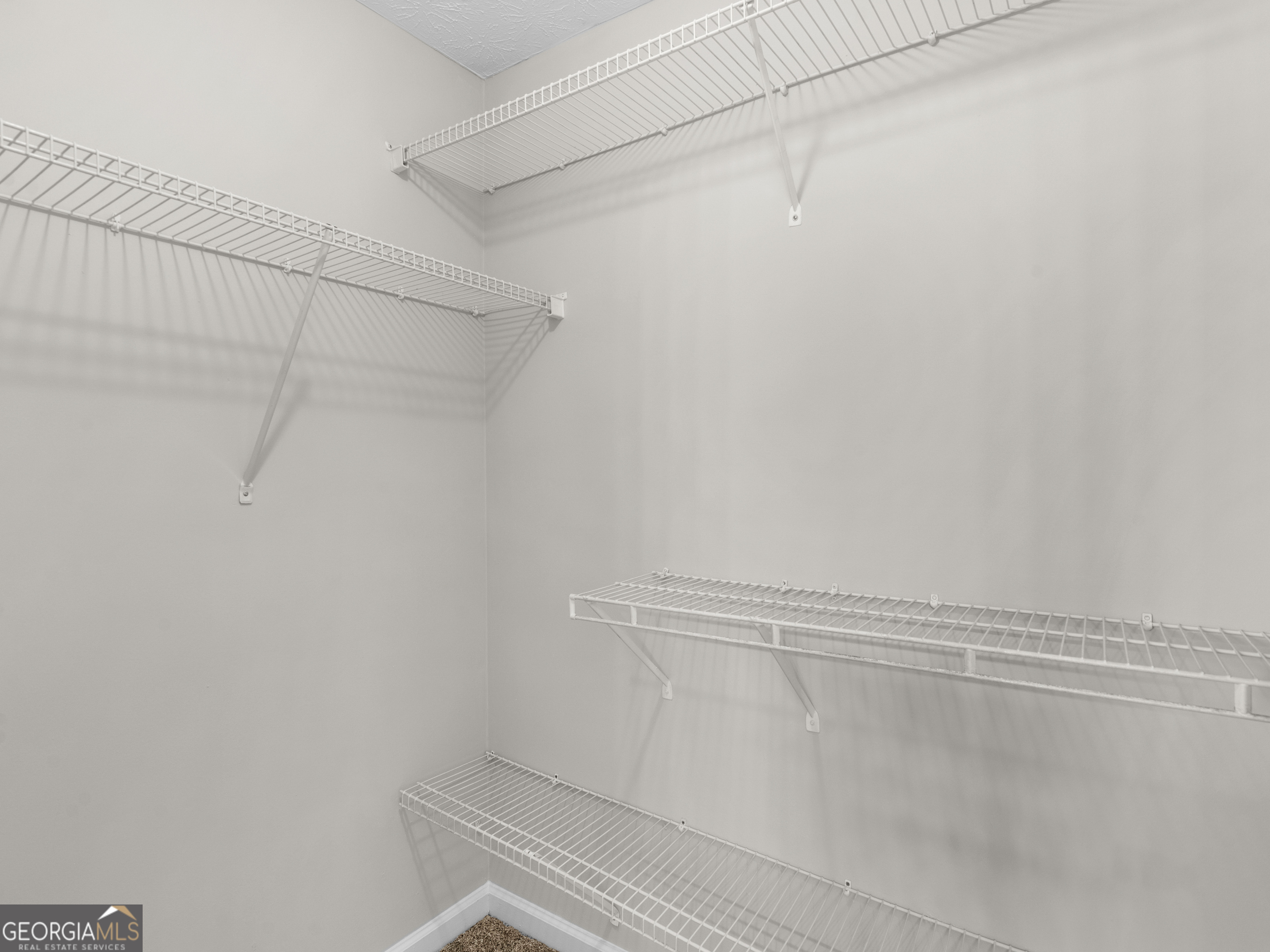 404 Northwind Place Stockbridge, GA 30281 - Photo 39 of 56 a view of a room with racks on the wall