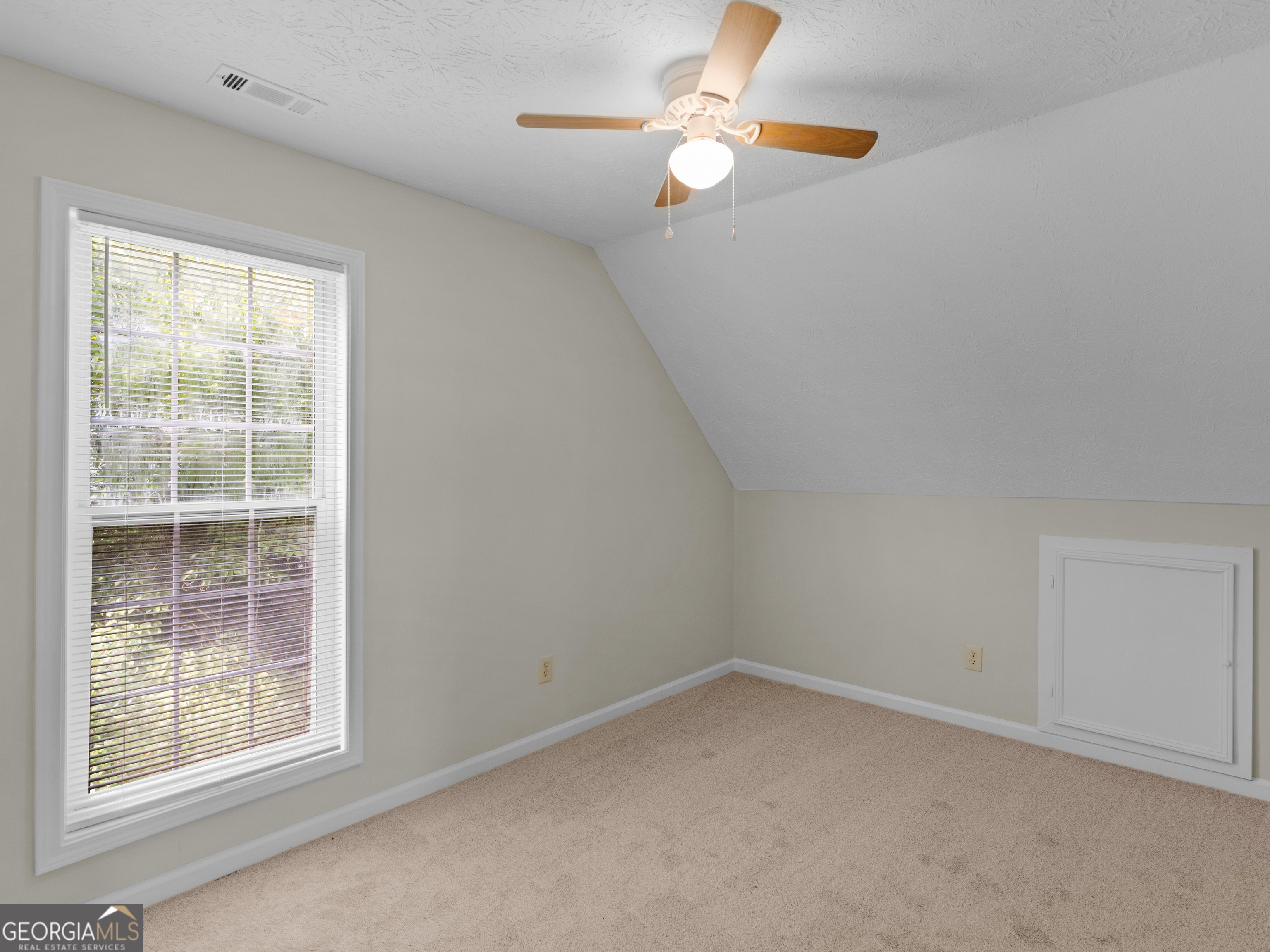 404 Northwind Place Stockbridge, GA 30281 - Photo 44 of 56 an empty room with a window