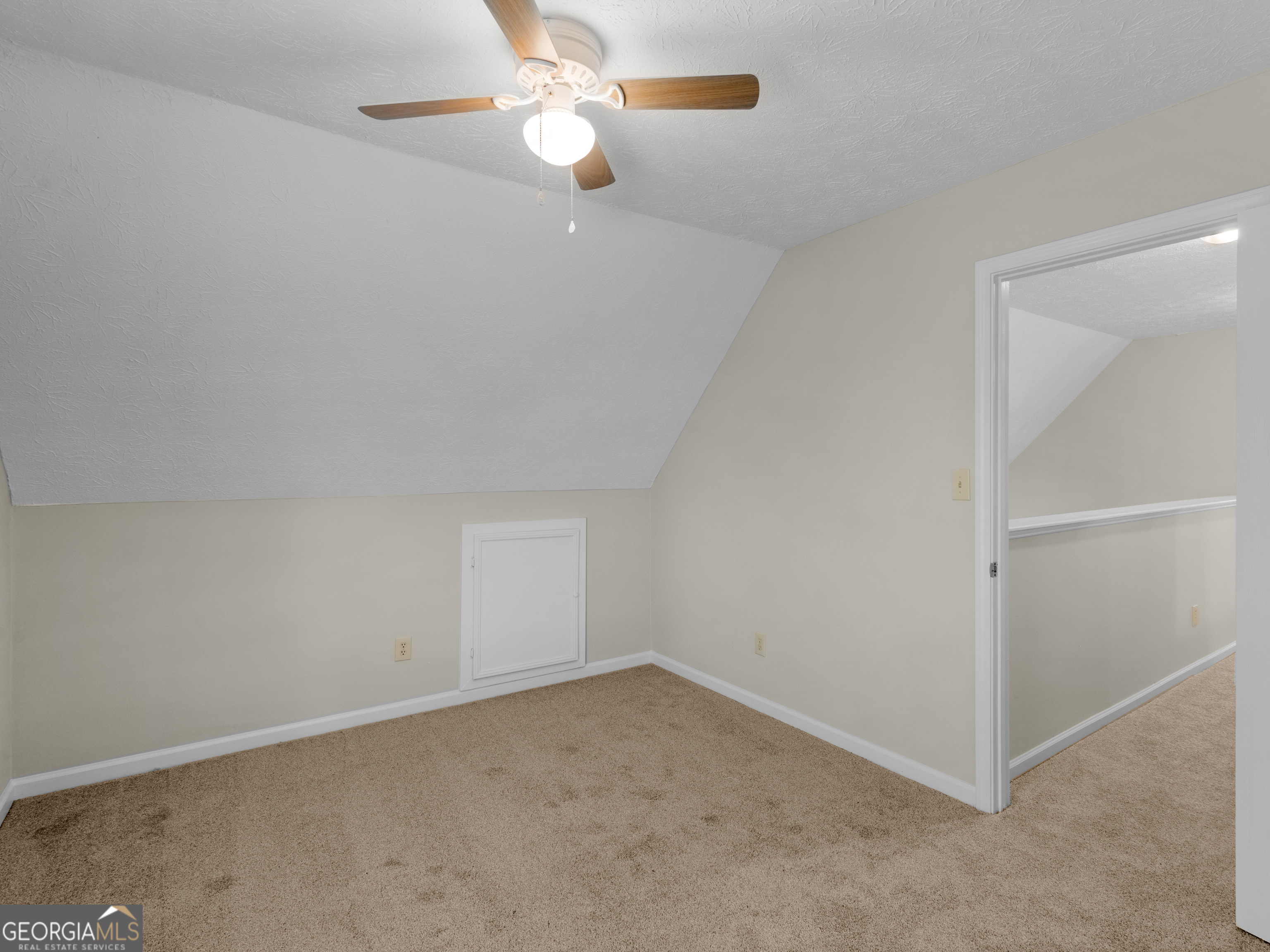 404 Northwind Place Stockbridge, GA 30281 - Photo 47 of 56 an empty room with a chandelier fan