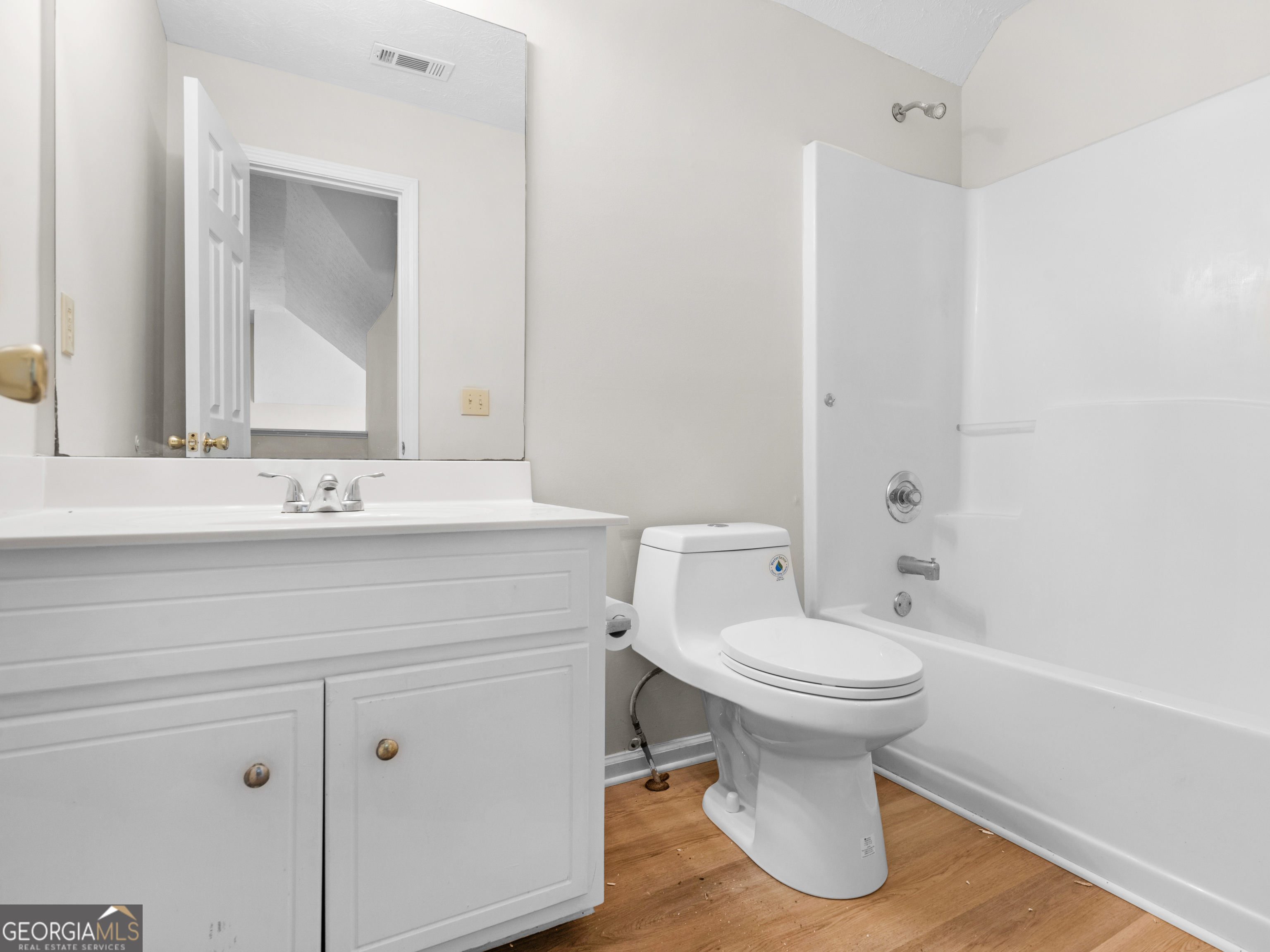 404 Northwind Place Stockbridge, GA 30281 - Photo 52 of 56 a bathroom with a sink toilet and a mirror