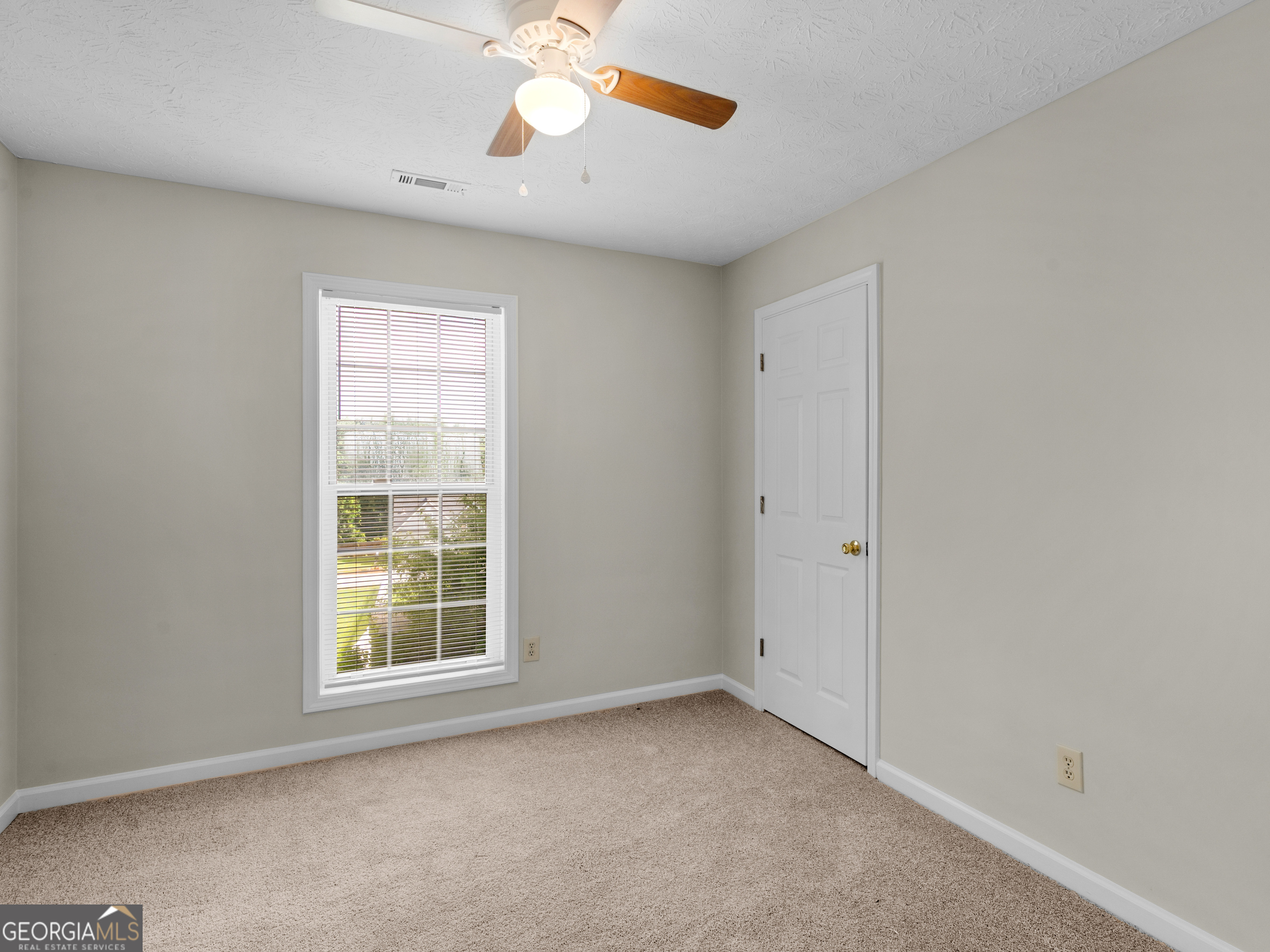 404 Northwind Place Stockbridge, GA 30281 - Photo 53 of 56 an empty room with a window