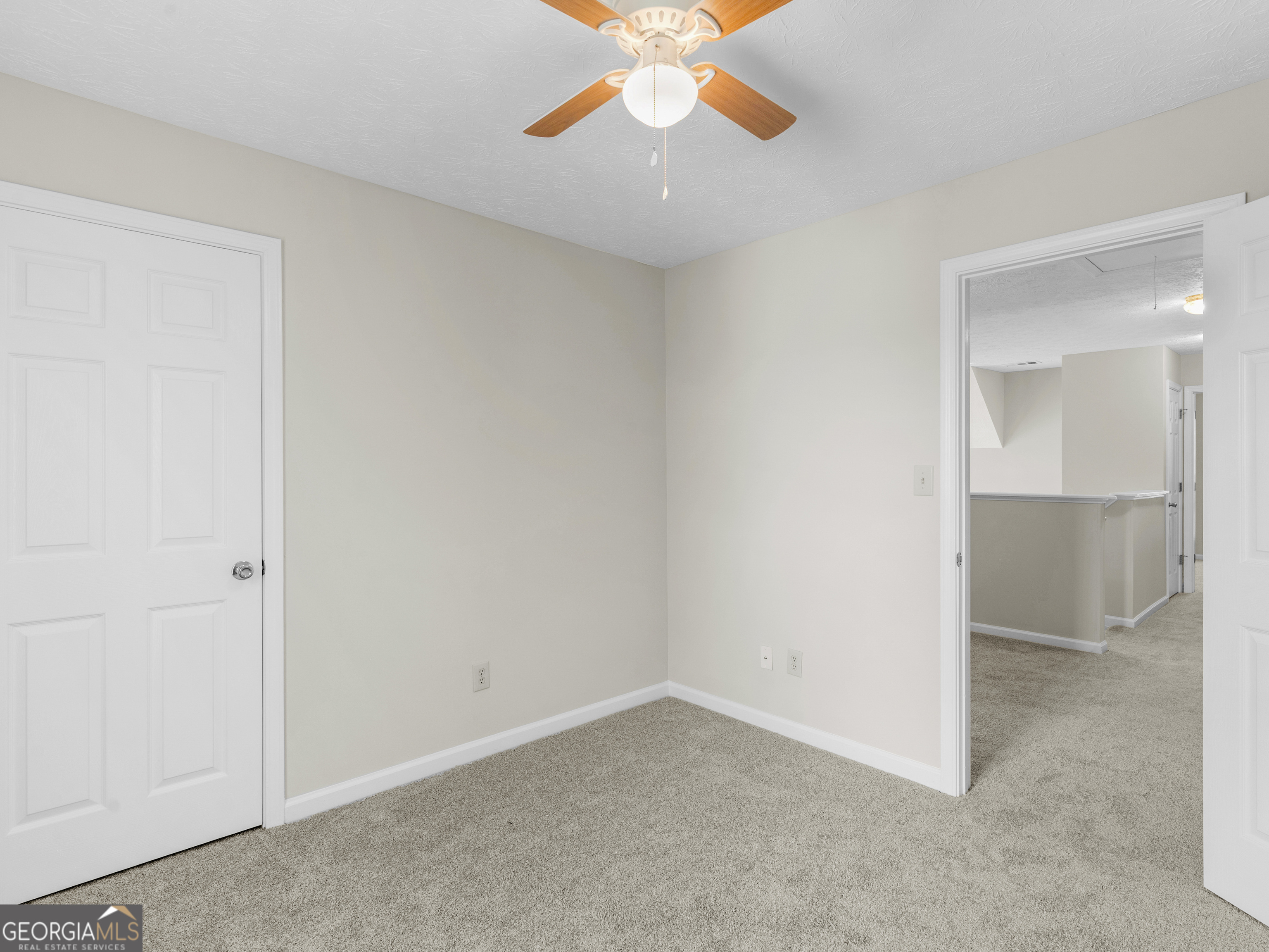 404 Northwind Place Stockbridge, GA 30281 - Photo 56 of 56 an empty room with closet and a chandelier fan