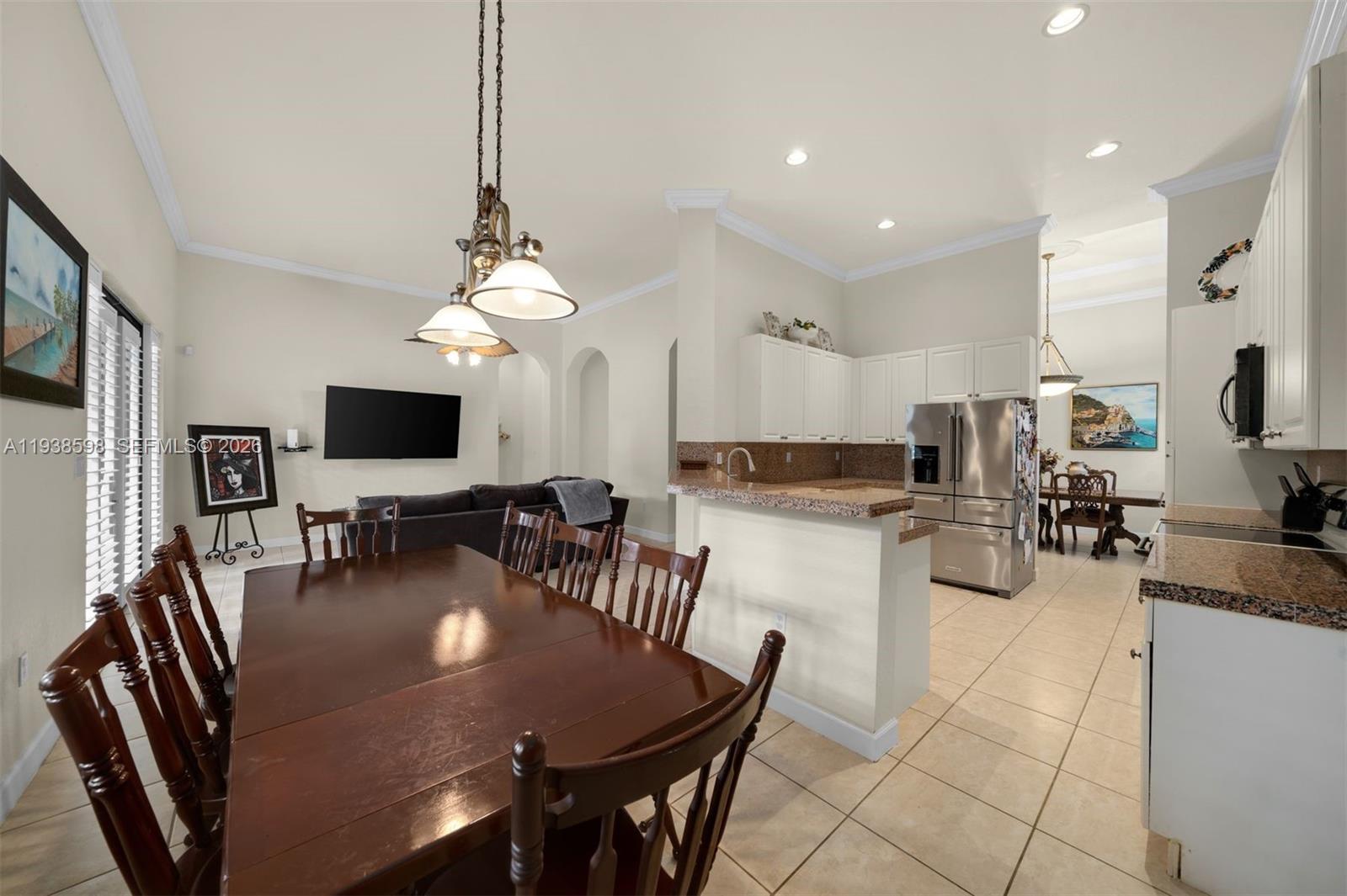 7548 Southwest 190th Street Cutler Bay, FL 33157 - Photo 13 of 53 a view of a dining room with furniture