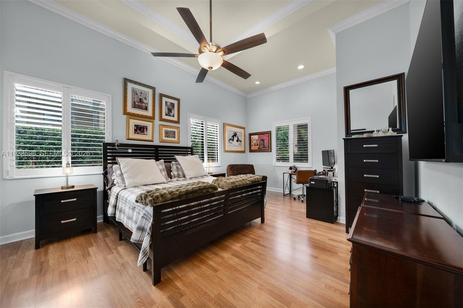 7548 Southwest 190th Street Cutler Bay, FL 33157 - Photo 17 of 53 a bedroom with a bed and wooden floor