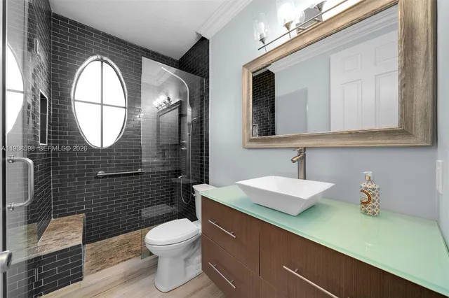 a bedroom with a bed and a desk