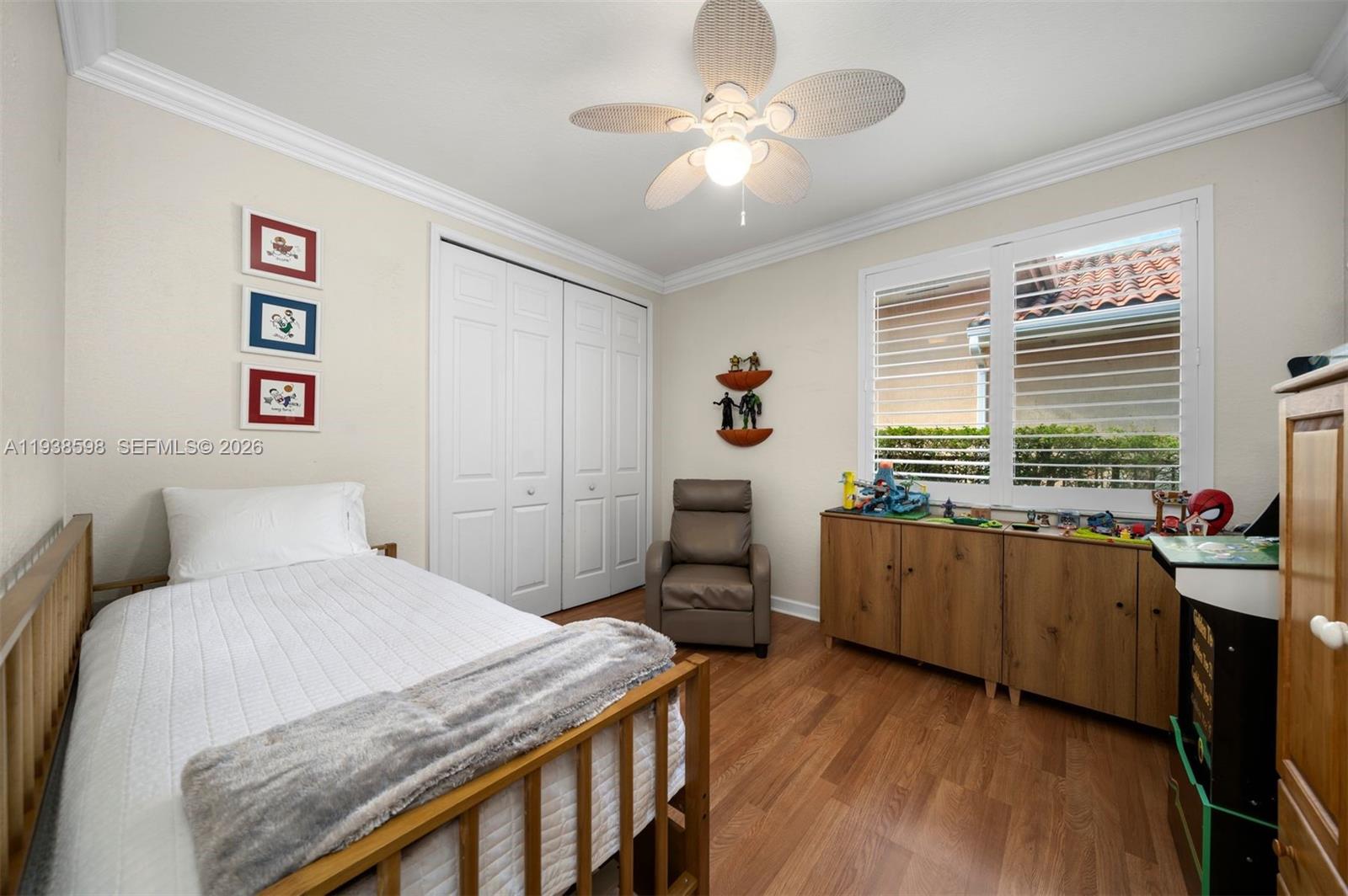 7548 Southwest 190th Street Cutler Bay, FL 33157 - Photo 27 of 53 a bedroom with a bed and a desk