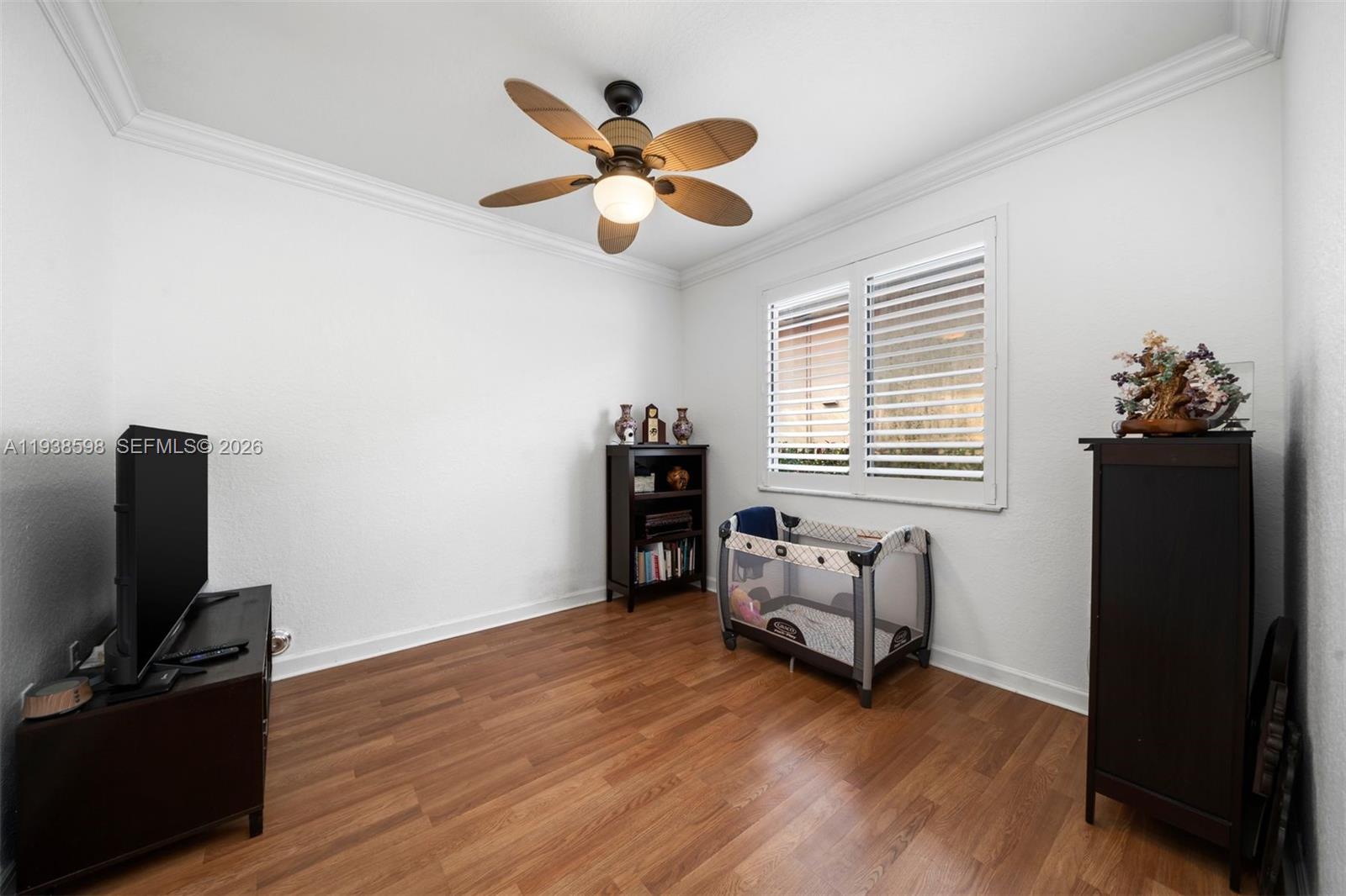 7548 Southwest 190th Street Cutler Bay, FL 33157 - Photo 29 of 53 a living room with furniture and a flat screen tv