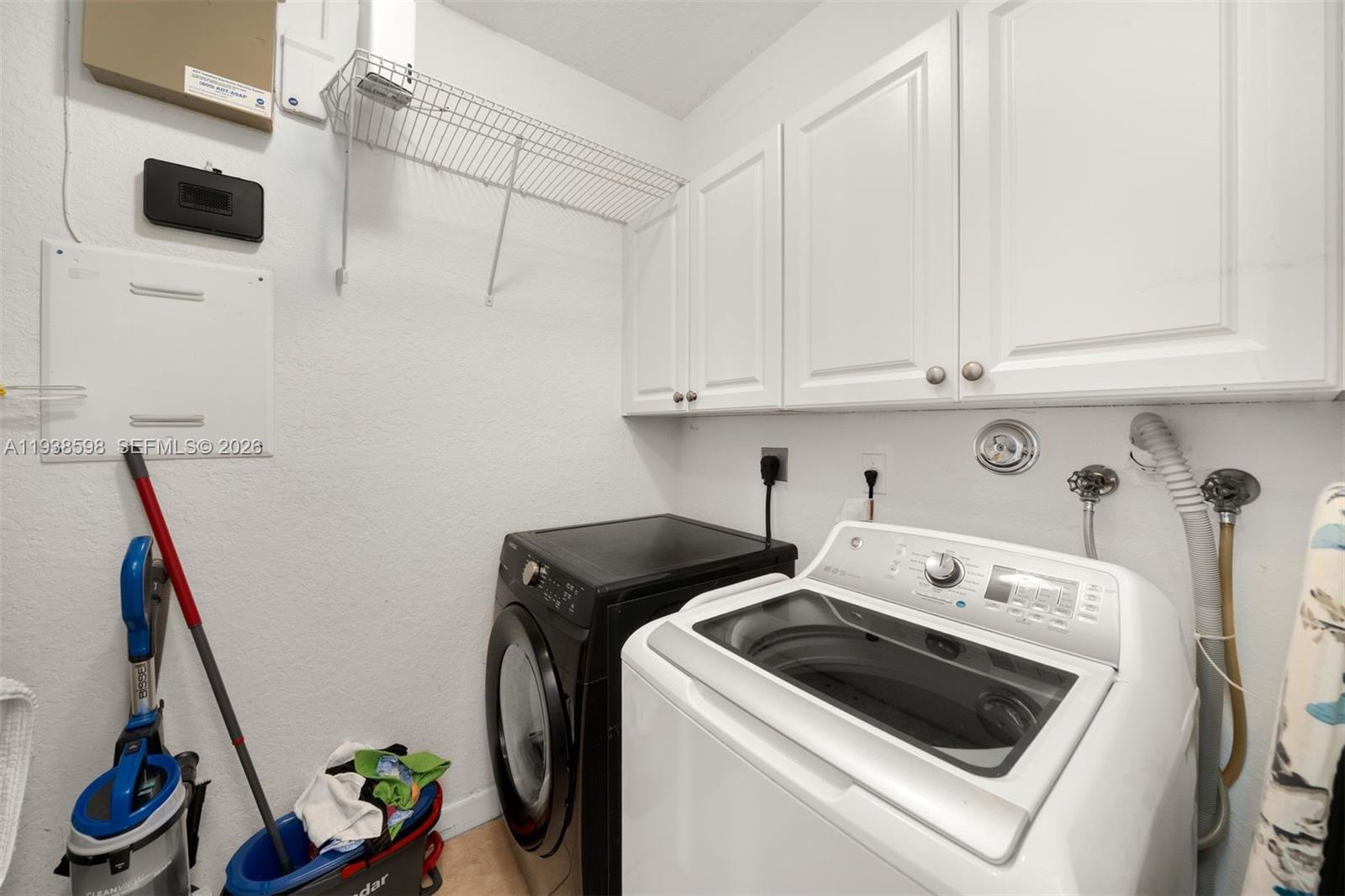7548 Southwest 190th Street Cutler Bay, FL 33157 - Photo 31 of 53 a utility room with dryer and washer