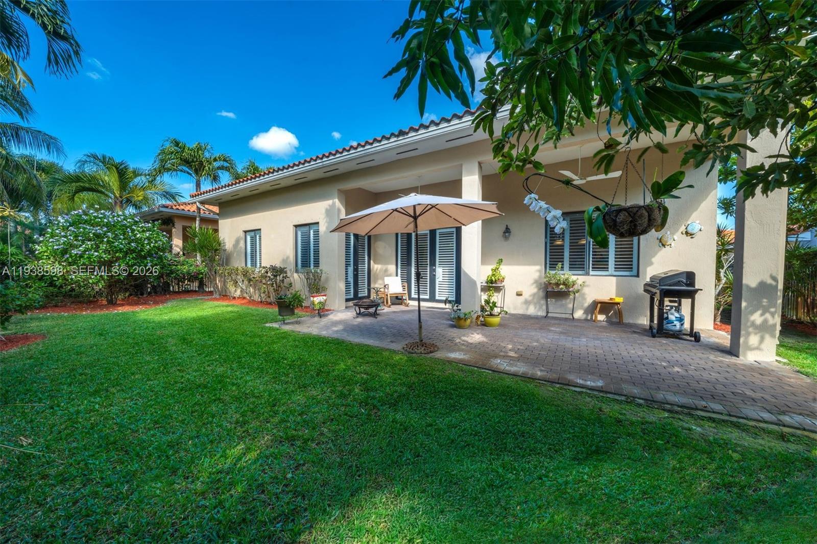 7548 Southwest 190th Street Cutler Bay, FL 33157 - Photo 32 of 53 a front view of a house with yard and green space