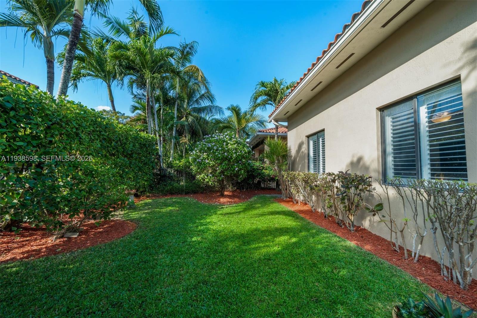 7548 Southwest 190th Street Cutler Bay, FL 33157 - Photo 35 of 53 a view of a backyard with plants and large trees