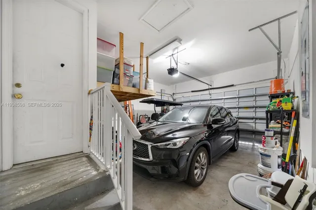 a view of a patio with a table and chairs