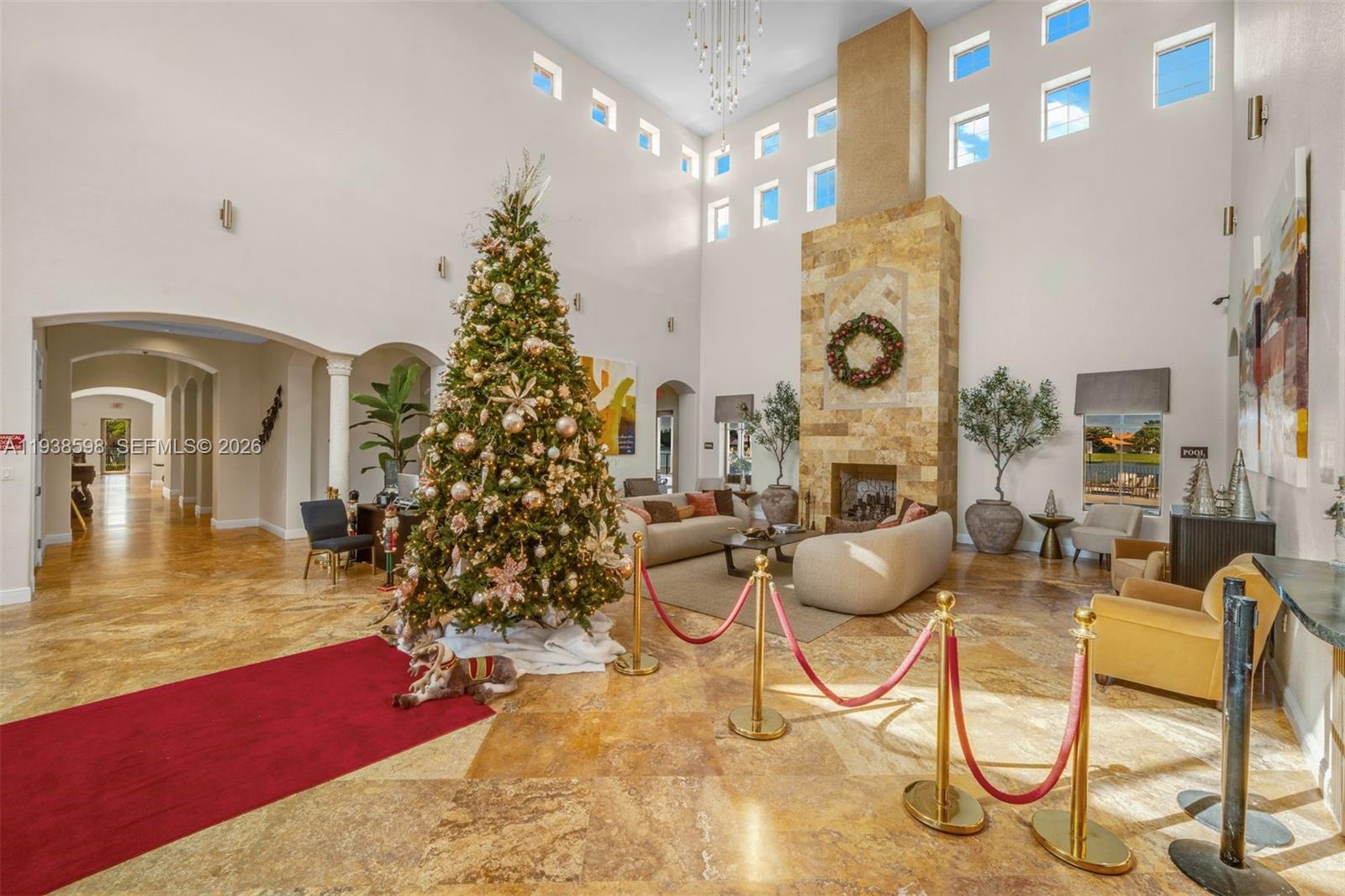 7548 Southwest 190th Street Cutler Bay, FL 33157 - Photo 42 of 53 a living room with furniture kitchen view and a chandelier