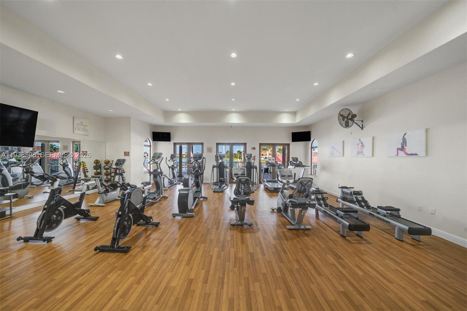 7548 Southwest 190th Street Cutler Bay, FL 33157 - Photo 47 of 53 a view of a room with gym equipment and wooden floor