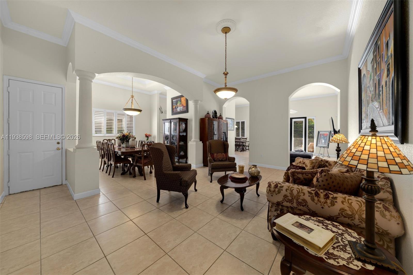 7548 Southwest 190th Street Cutler Bay, FL 33157 - Photo 6 of 53 a living room with furniture and chandelier