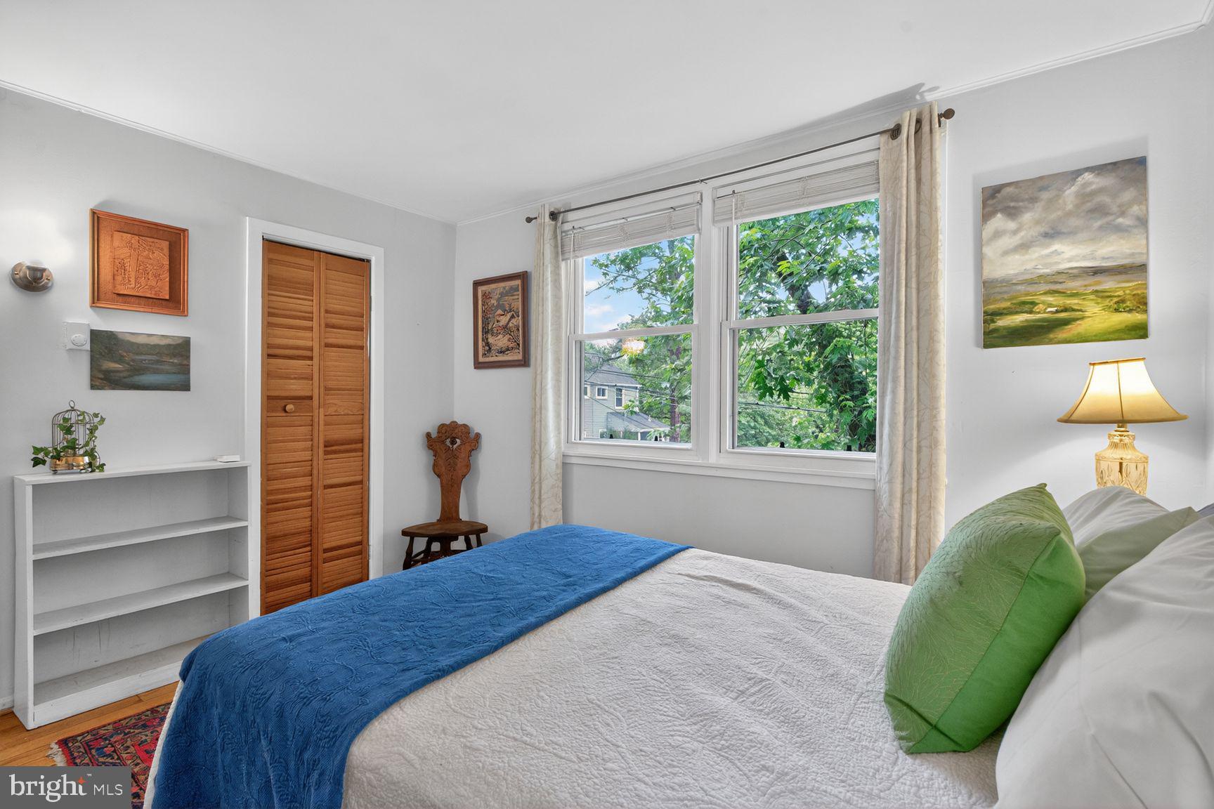 51 Ridge Road Greenbelt, MD 20770 - Photo 11 of 23 a bedroom with a bed and window with outer view