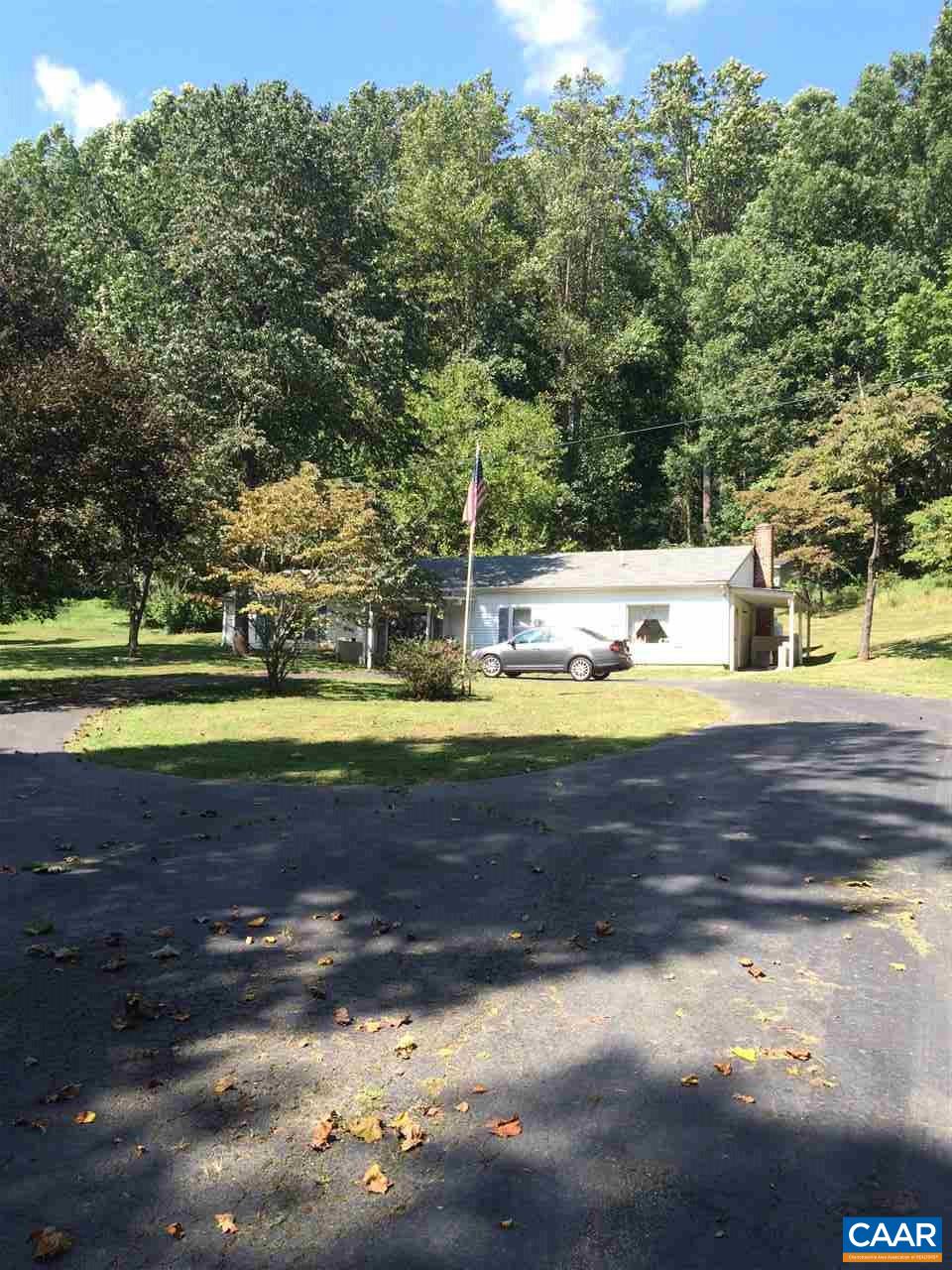 a view of a yard with swimming pool