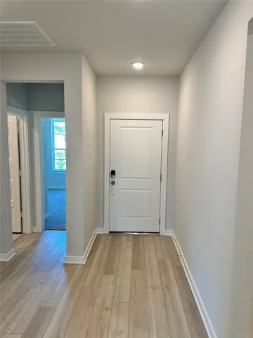wooden floor in an empty room with a gallery