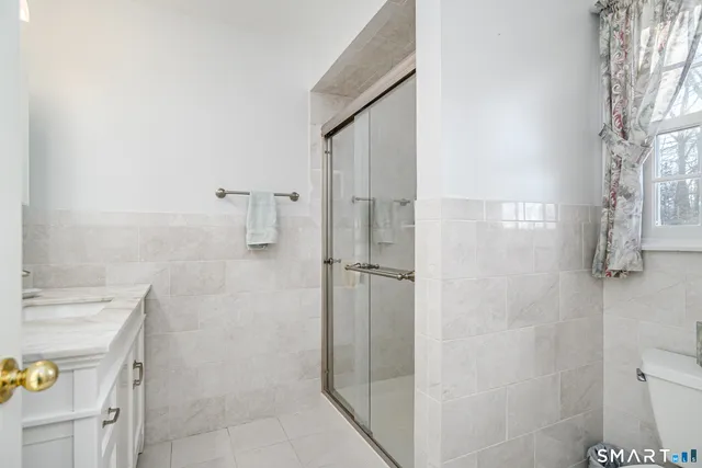 a bathroom with a shower and toilet
