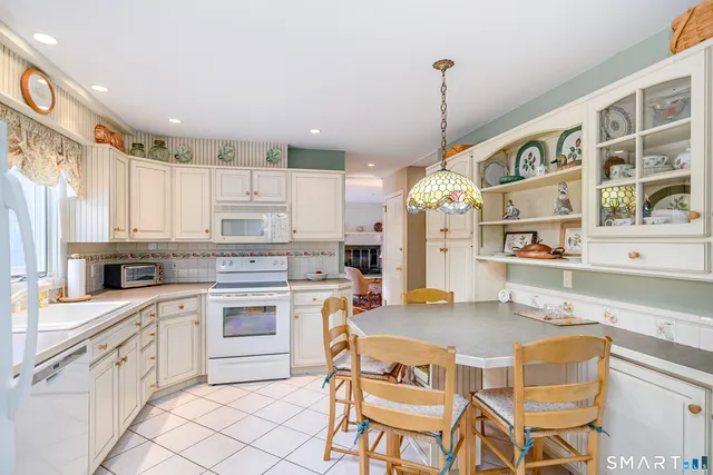 a kitchen with cabinets a sink and appliances