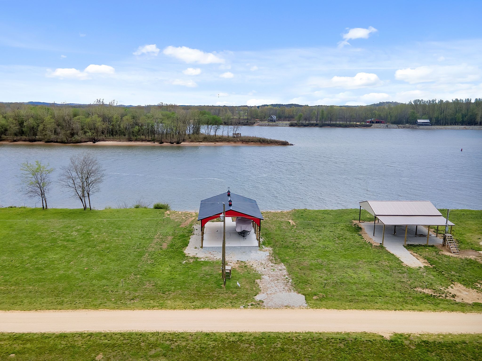 a view of a lake with couches and city view