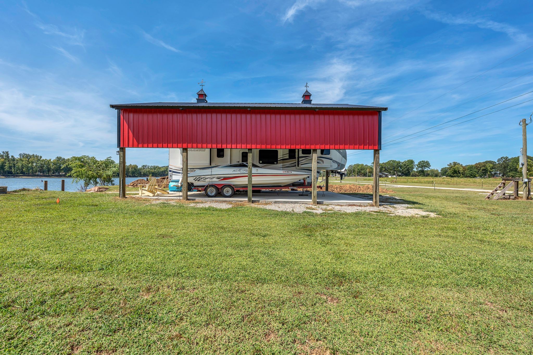 894 Lexi Lane Clifton, TN 38425 - Photo 17 of 35 a view of a big yard with table and chairs under an umbrella