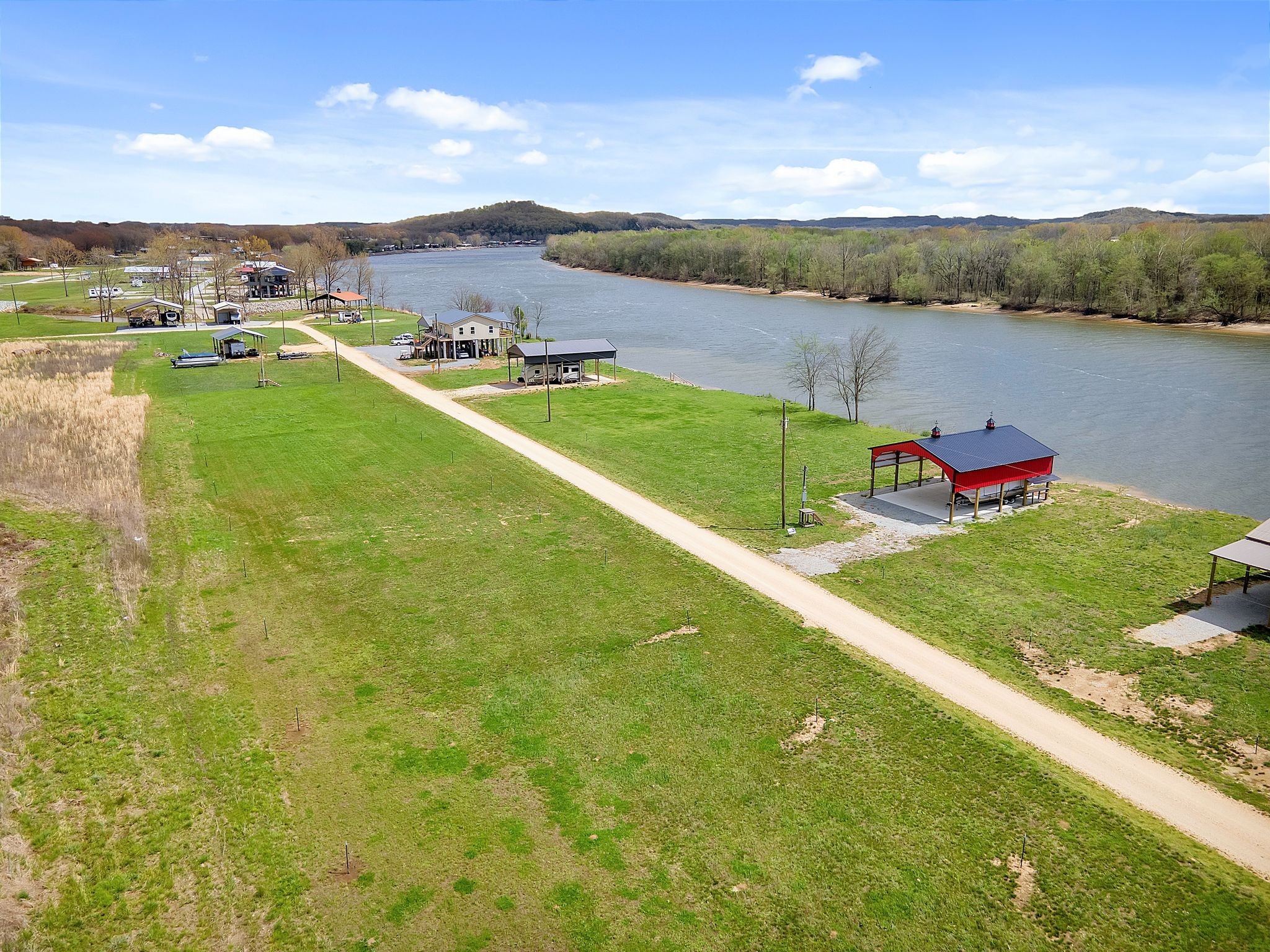 894 Lexi Lane Clifton, TN 38425 - Photo 2 of 35 a view of a lake with houses in the background