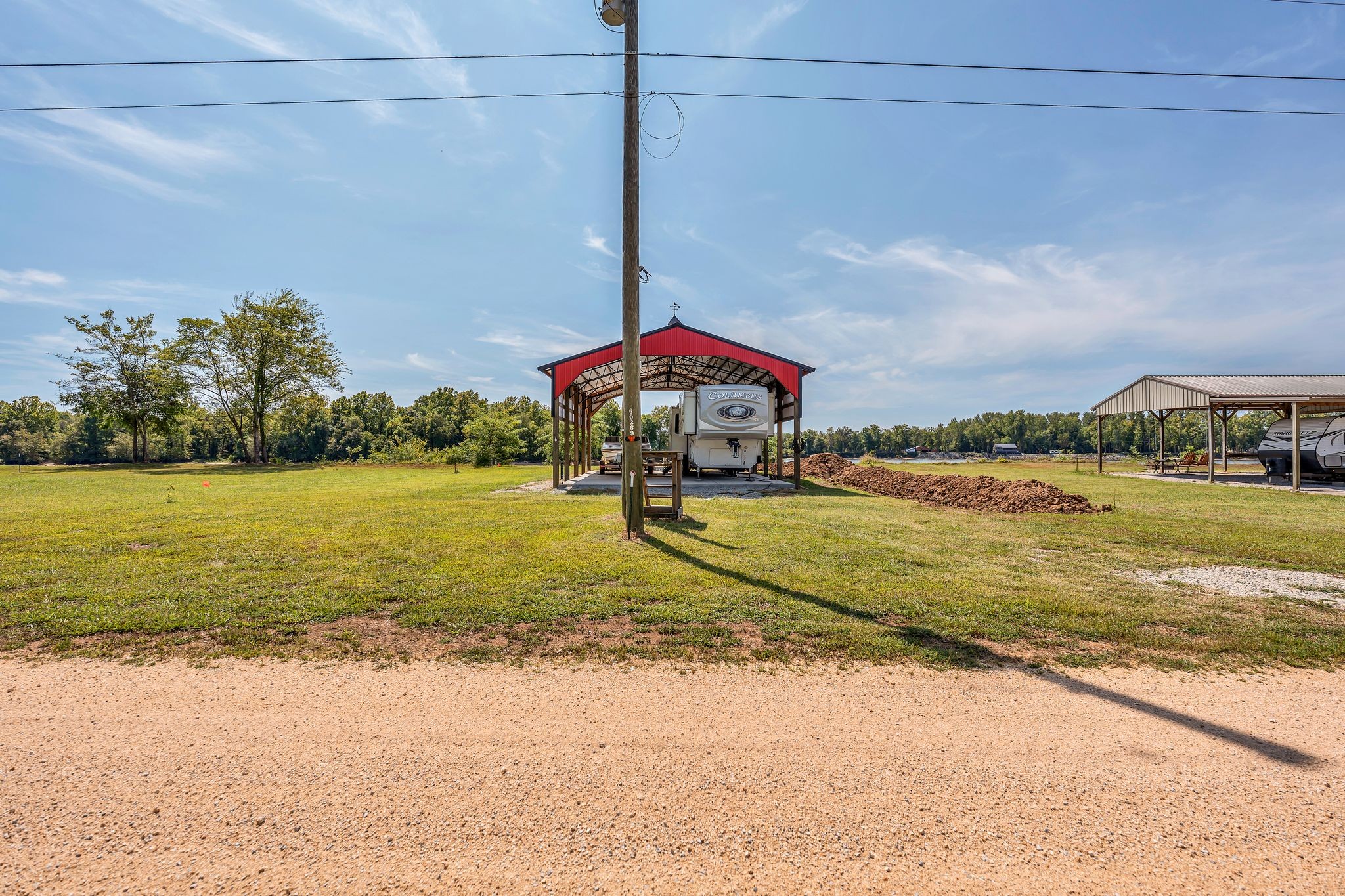 894 Lexi Lane Clifton, TN 38425 - Photo 22 of 35 a view of a lake with a yard