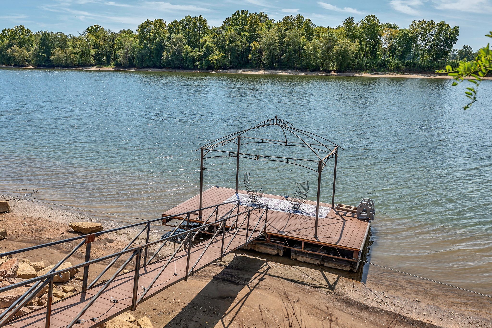 894 Lexi Lane Clifton, TN 38425 - Photo 26 of 35 a view of a lake with a bench
