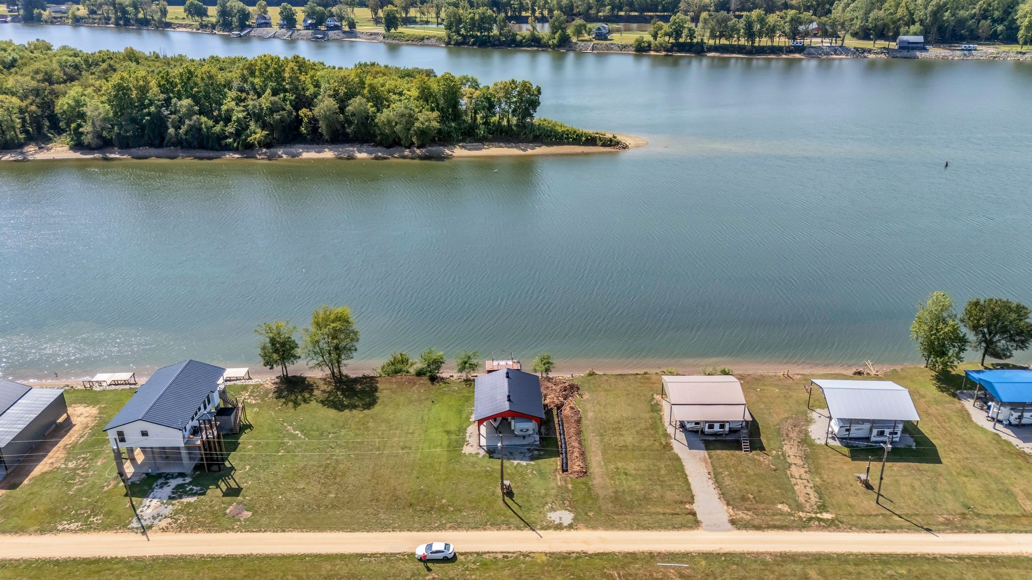 894 Lexi Lane Clifton, TN 38425 - Photo 27 of 35 an aerial view of a house with swimming pool patio and lake view