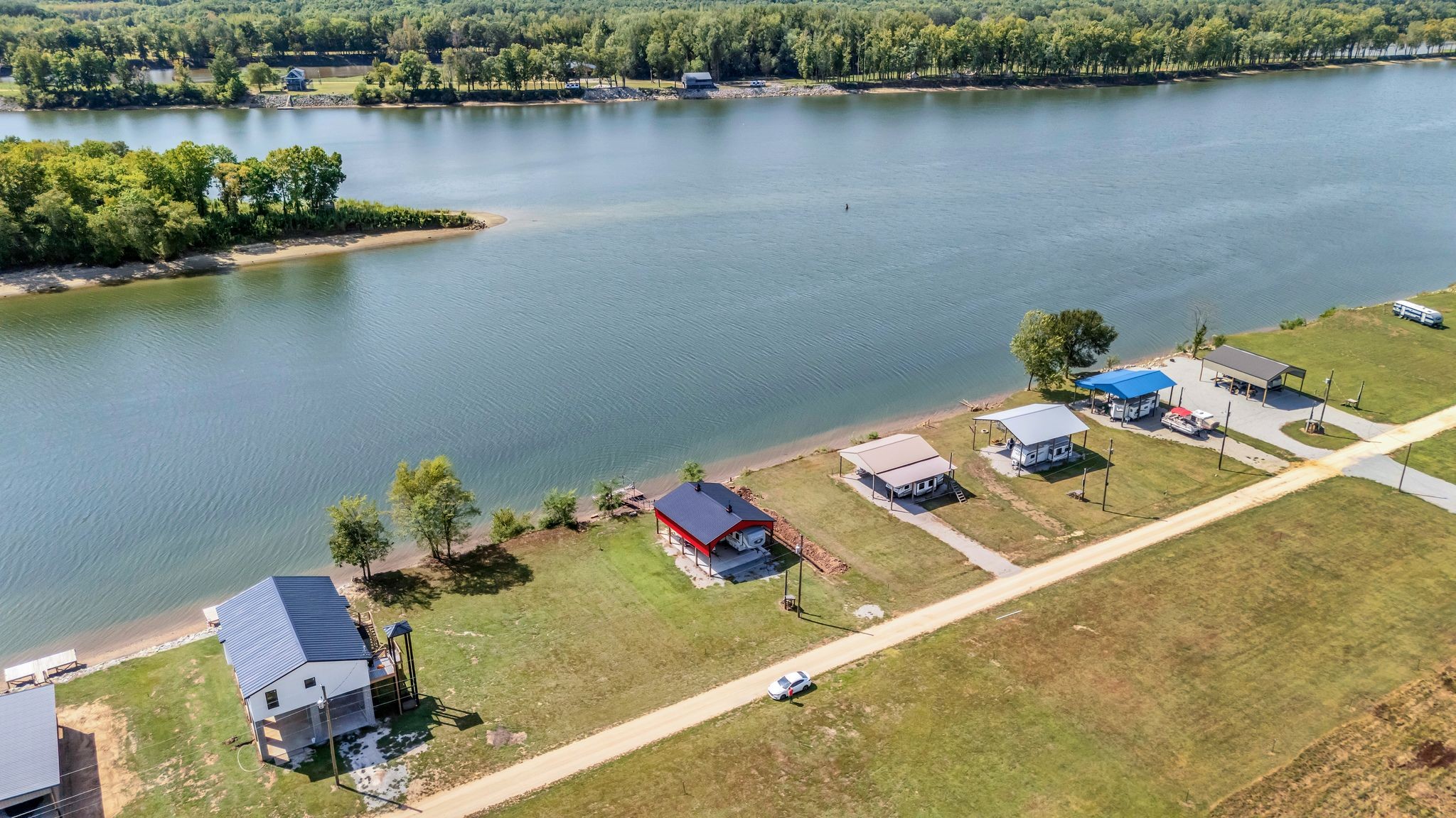 894 Lexi Lane Clifton, TN 38425 - Photo 28 of 35 a view of a lake with a table and chairs in it