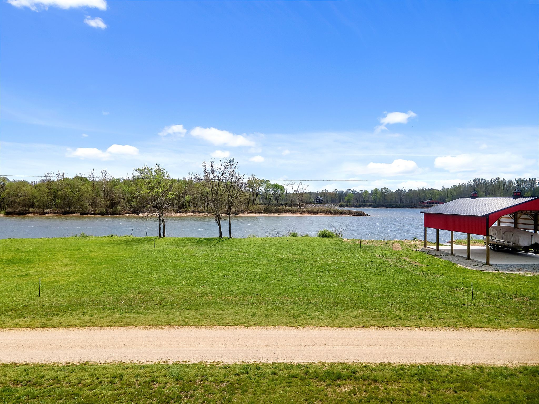 894 Lexi Lane Clifton, TN 38425 - Photo 5 of 35 a view of a lake with houses in the background