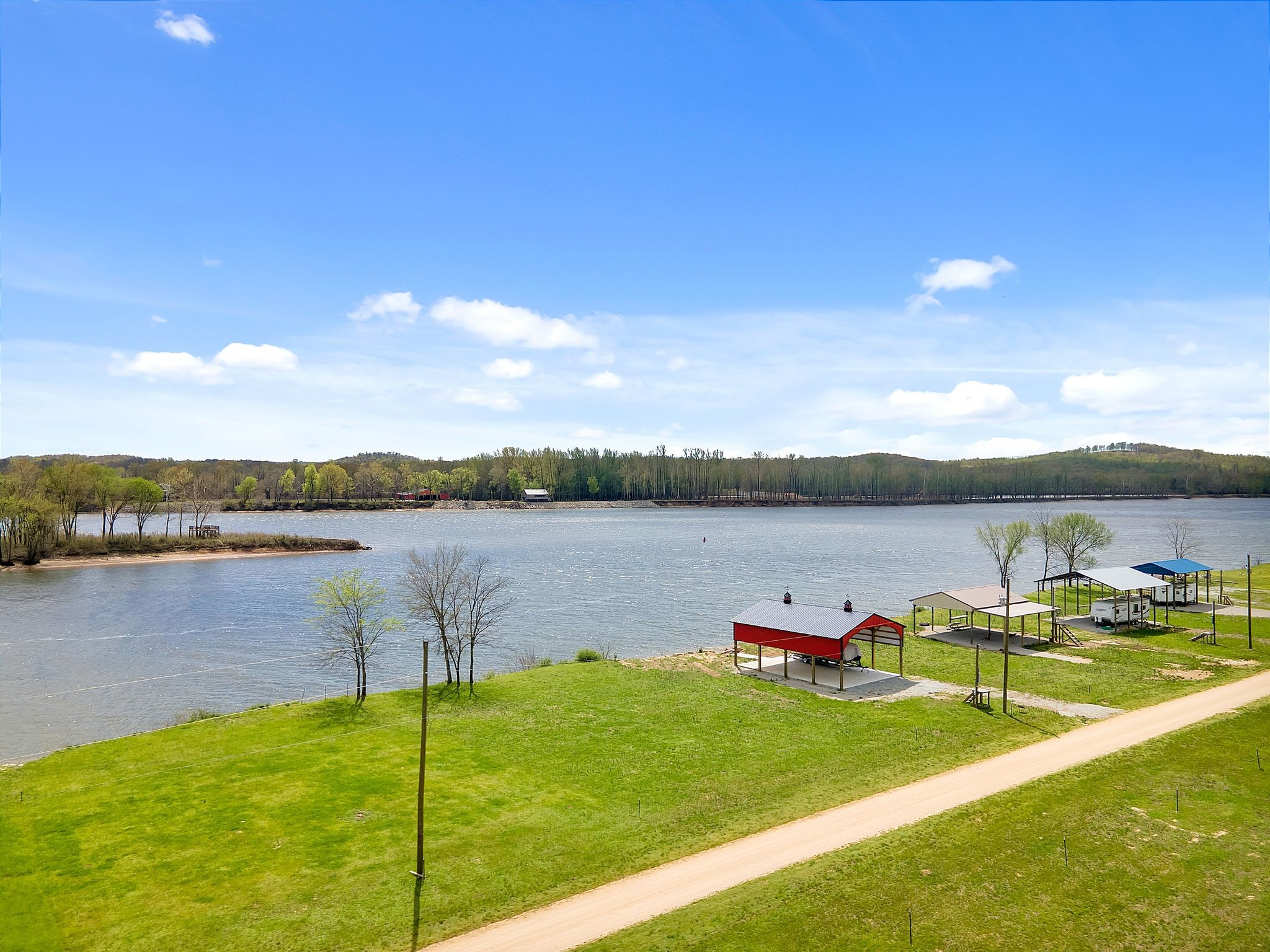 894 Lexi Lane Clifton, TN 38425 - Photo 6 of 35 a view of a lake with houses in the back