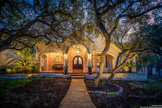 a front view of a house with garden