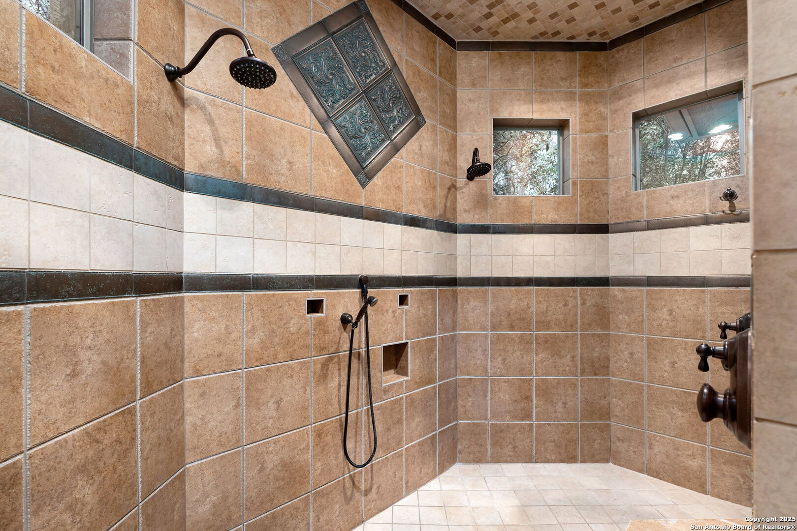 20027 Buckhead Lane Garden Ridge, TX 78266 - Photo 21 of 70 a bathroom with a mirror and a shower