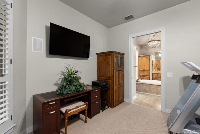 a dining room with furniture a rug and wooden floor