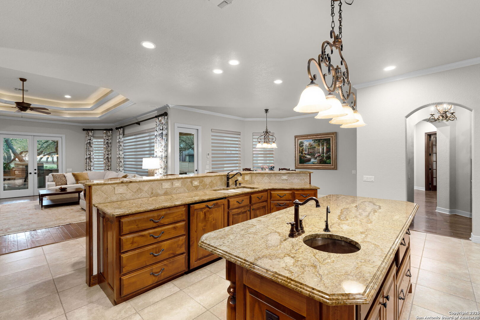 20027 Buckhead Lane Garden Ridge, TX 78266 - Photo 32 of 70 a dining hall with stainless steel appliances granite countertop a kitchen island a table and chairs