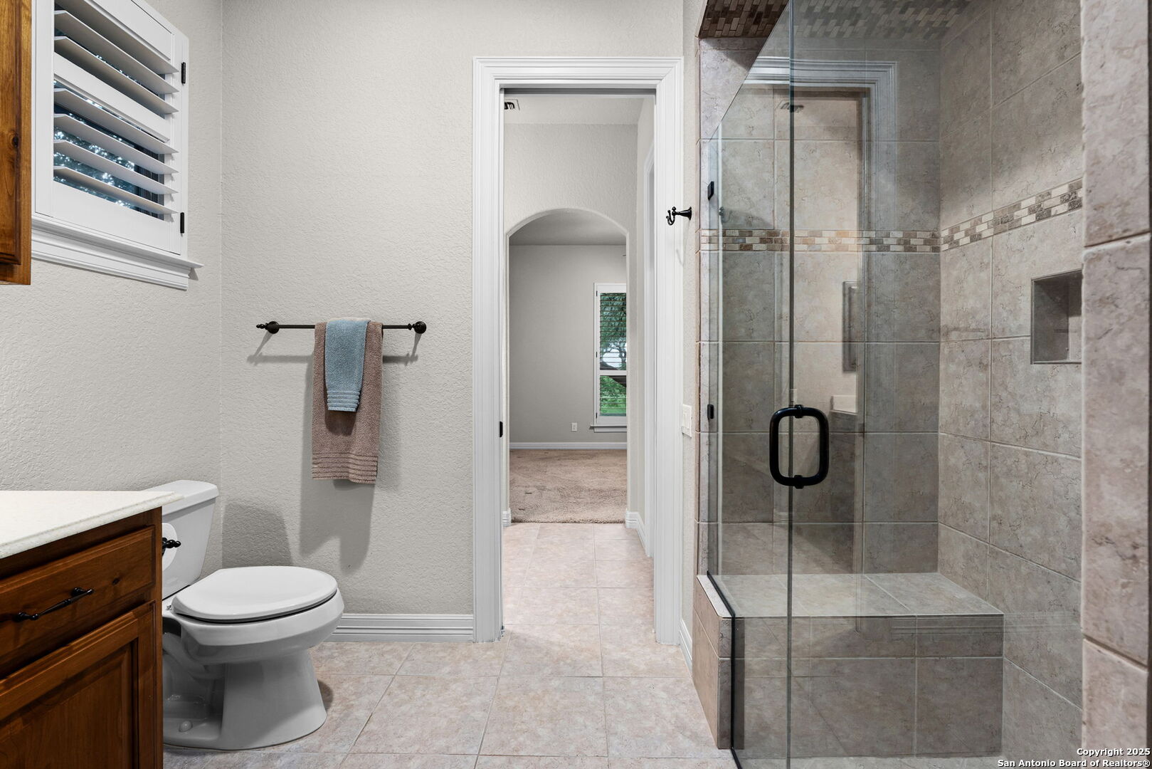 20027 Buckhead Lane Garden Ridge, TX 78266 - Photo 42 of 70 a bathroom with a granite countertop shower a toilet and a sink