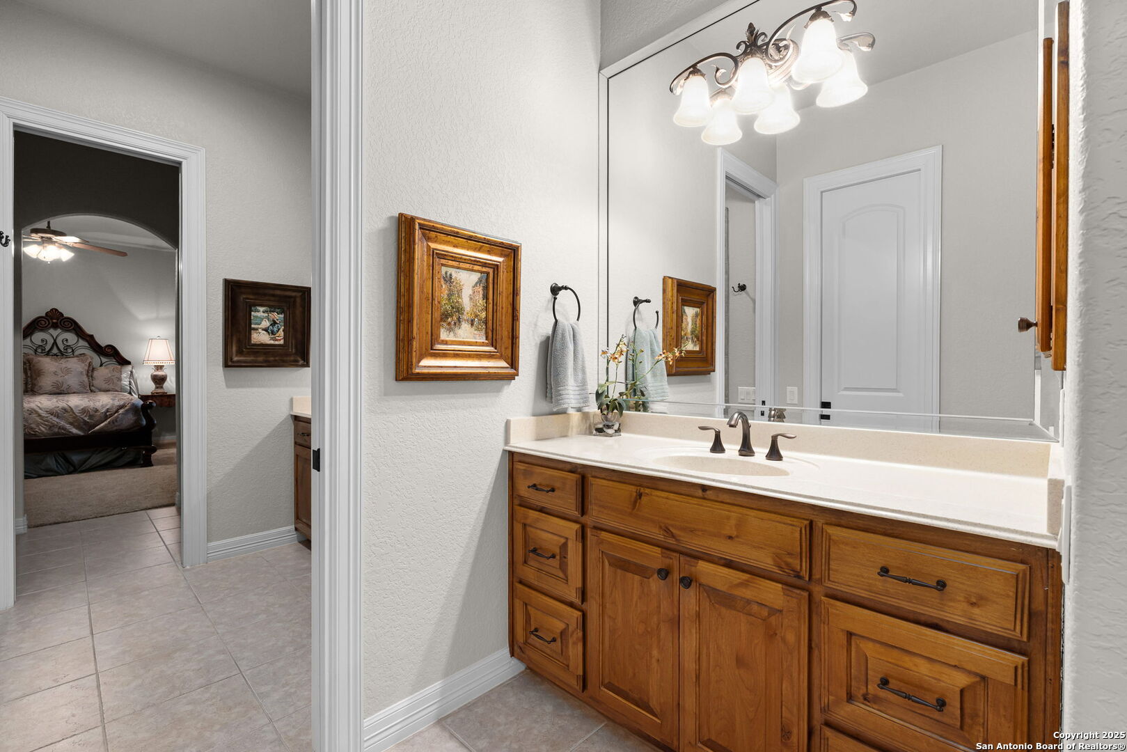 20027 Buckhead Lane Garden Ridge, TX 78266 - Photo 43 of 70 a en suite bathroom with a double vanity sink and a mirror