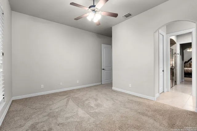 a backyard of a house with barbeque oven table and chairs