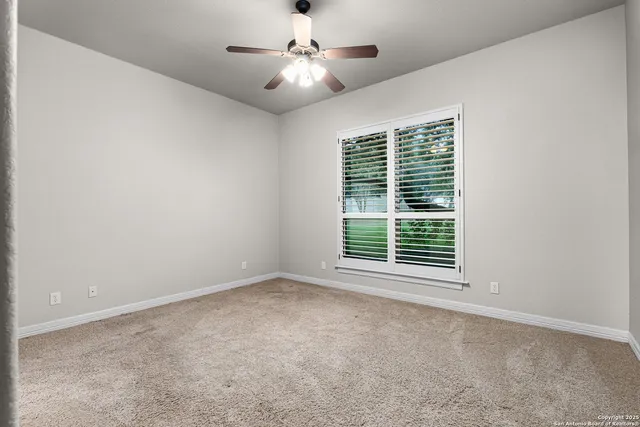 a view of a porch with furniture and a yard