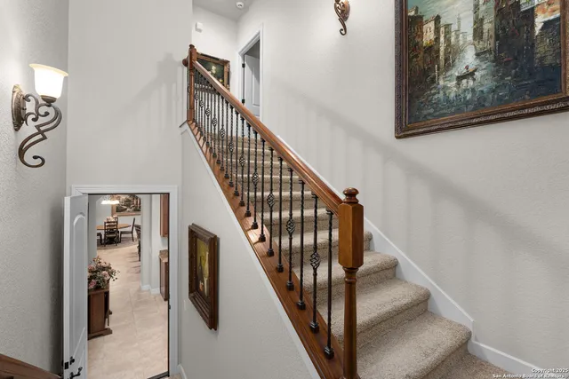 a view of a backyard with large trees