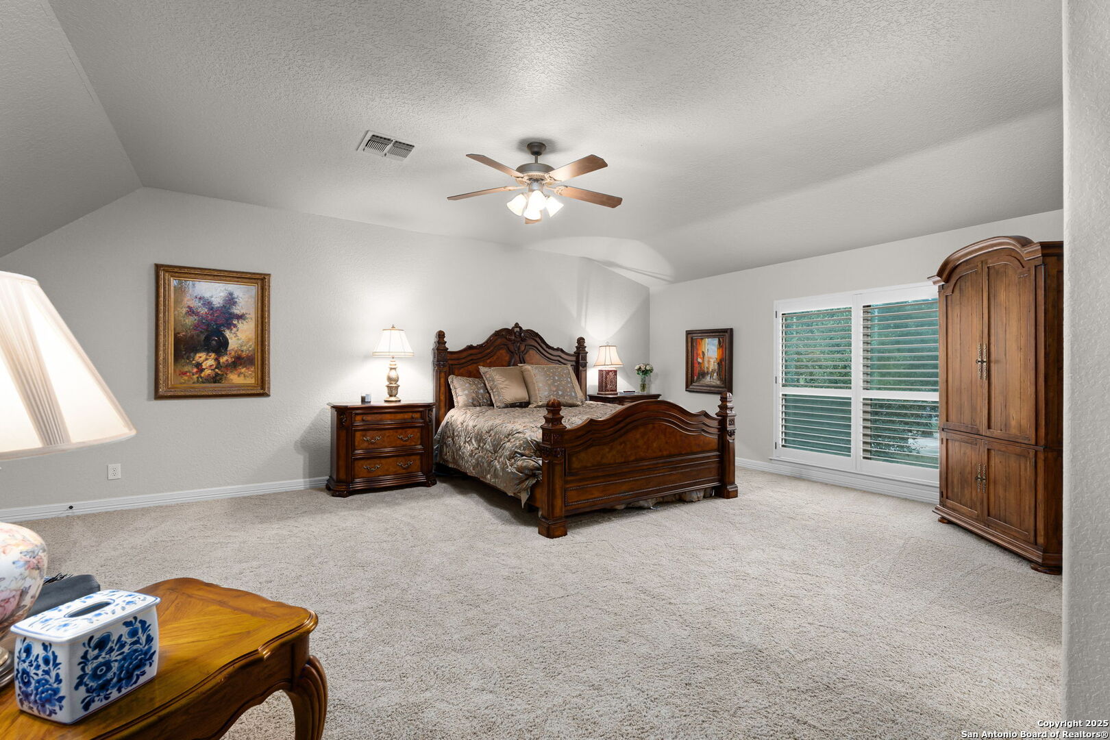 20027 Buckhead Lane Garden Ridge, TX 78266 - Photo 47 of 70 a bedroom with a bed and a chandelier