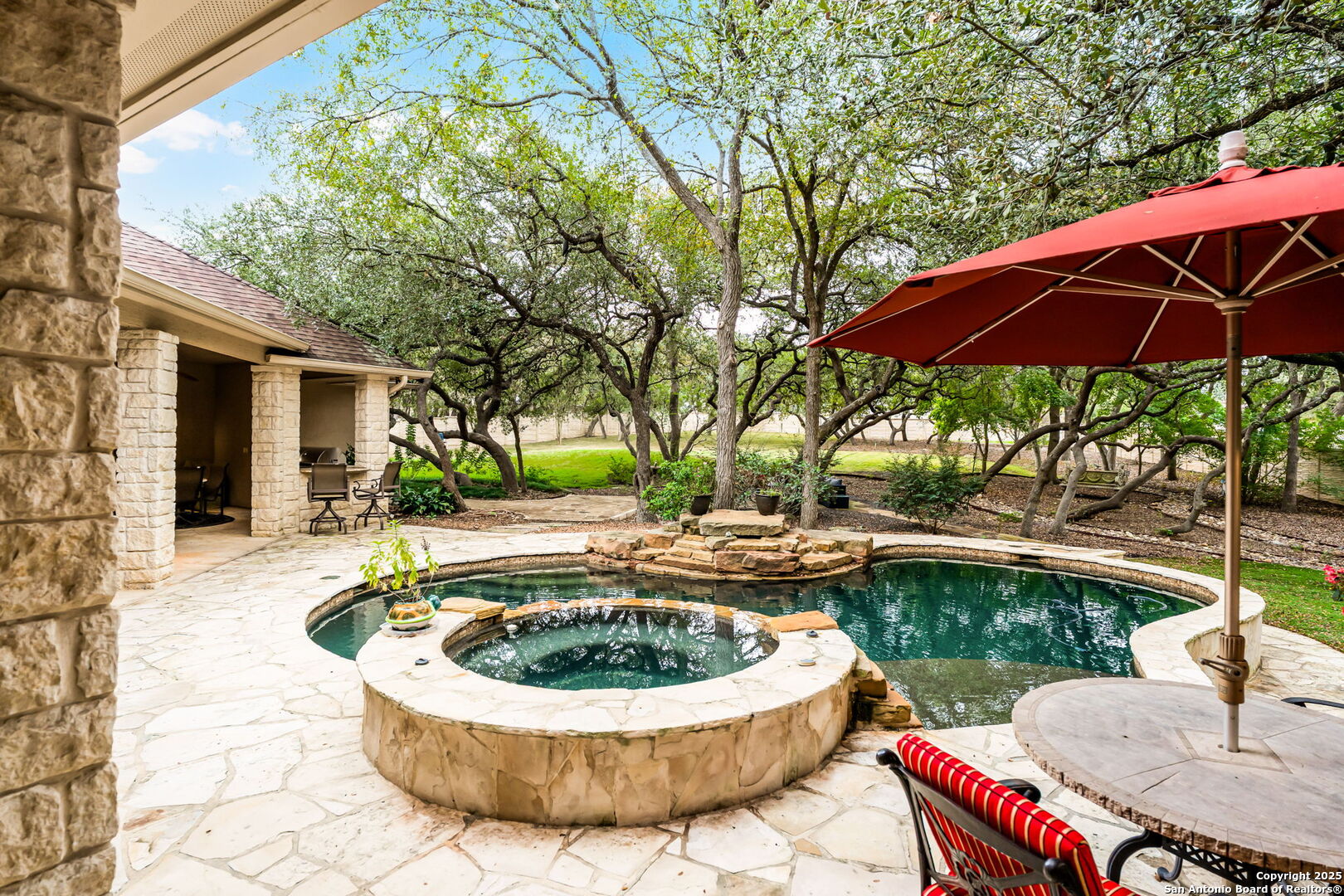 20027 Buckhead Lane Garden Ridge, TX 78266 - Photo 58 of 70 a view of a house with backyard sitting area and swimming pool