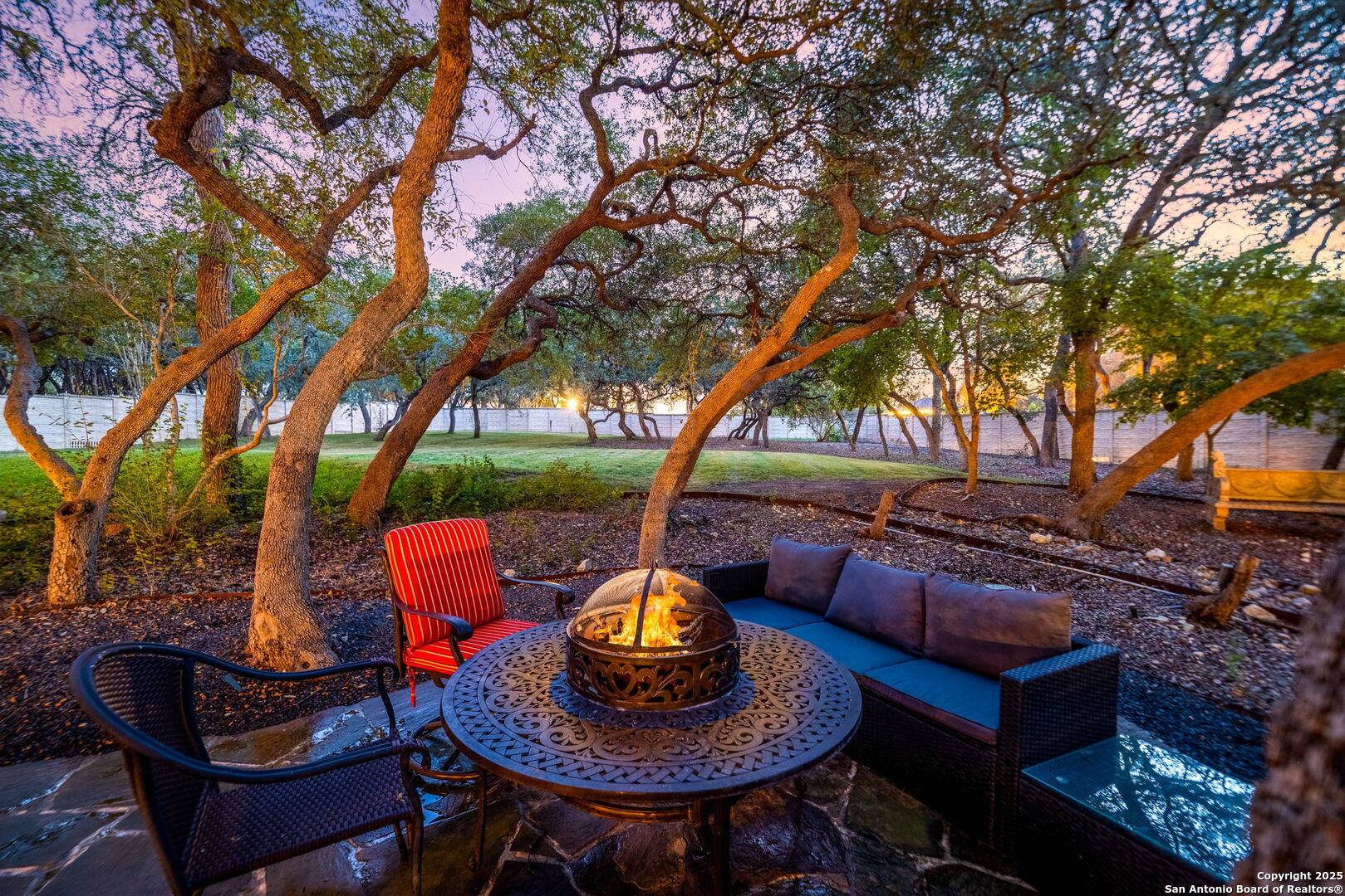 20027 Buckhead Lane Garden Ridge, TX 78266 - Photo 60 of 70 a backyard of a house with barbeque oven table and chairs