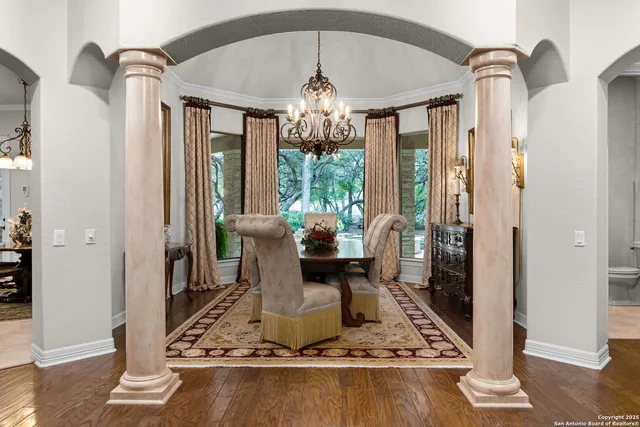 a bathroom with a granite countertop toilet a sink and a mirror