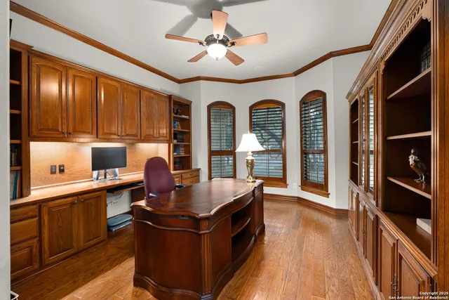 a spacious bedroom with a bed and a chandelier