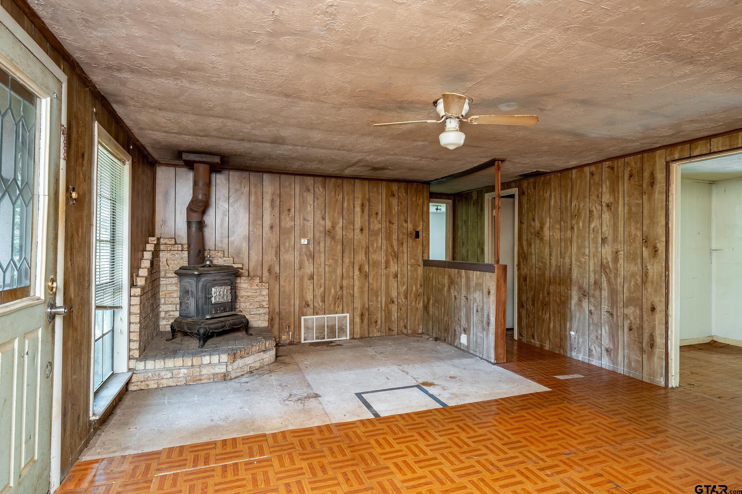 13174 County Road 434 Lindale, TX 75771 - Photo 22 of 32 a view of a bedroom with wooden floor and a ceiling fan