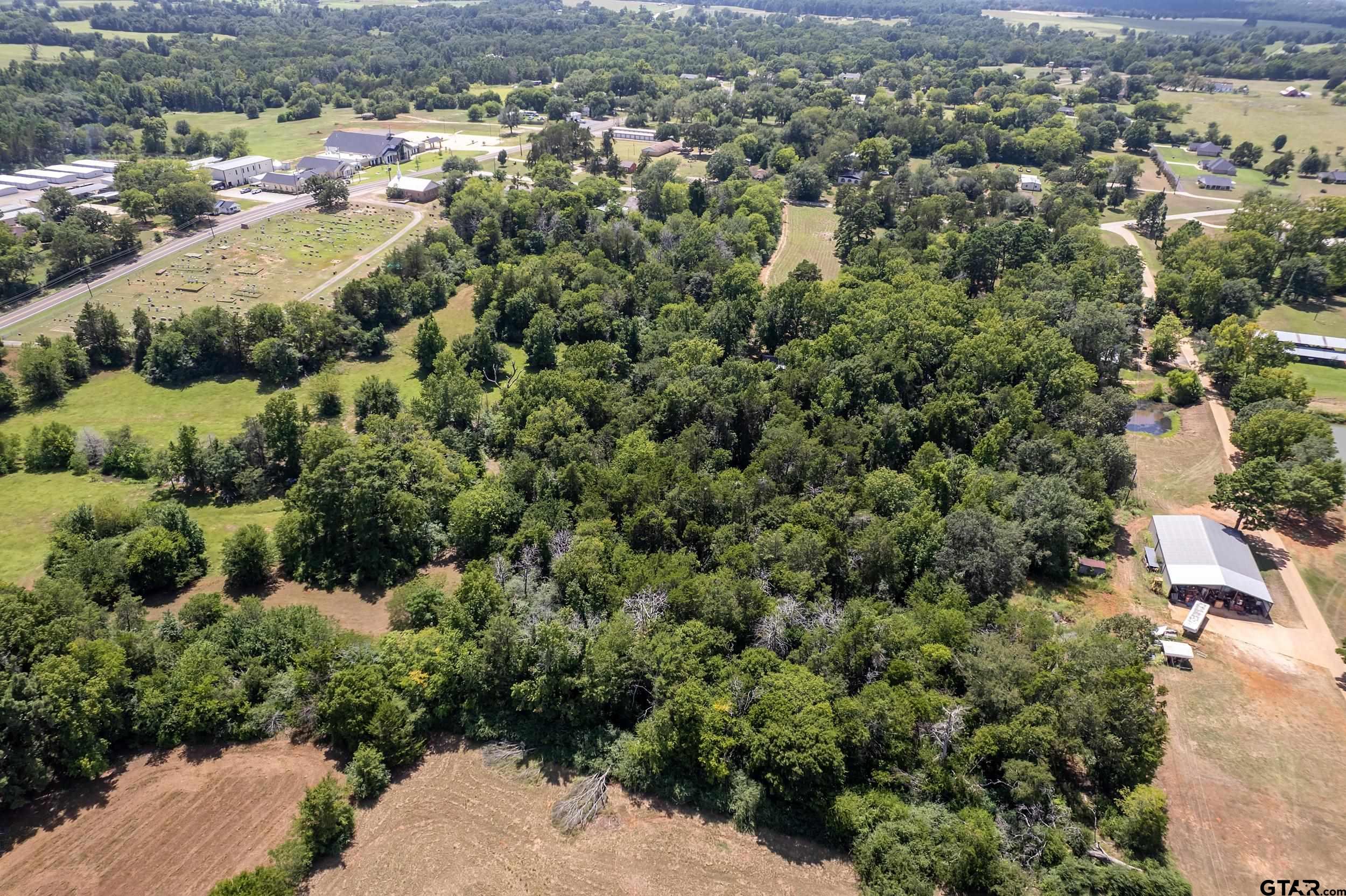 13174 County Road 434 Lindale, TX 75771 - Photo 30 of 32 an aerial view of residential houses with outdoor space and trees